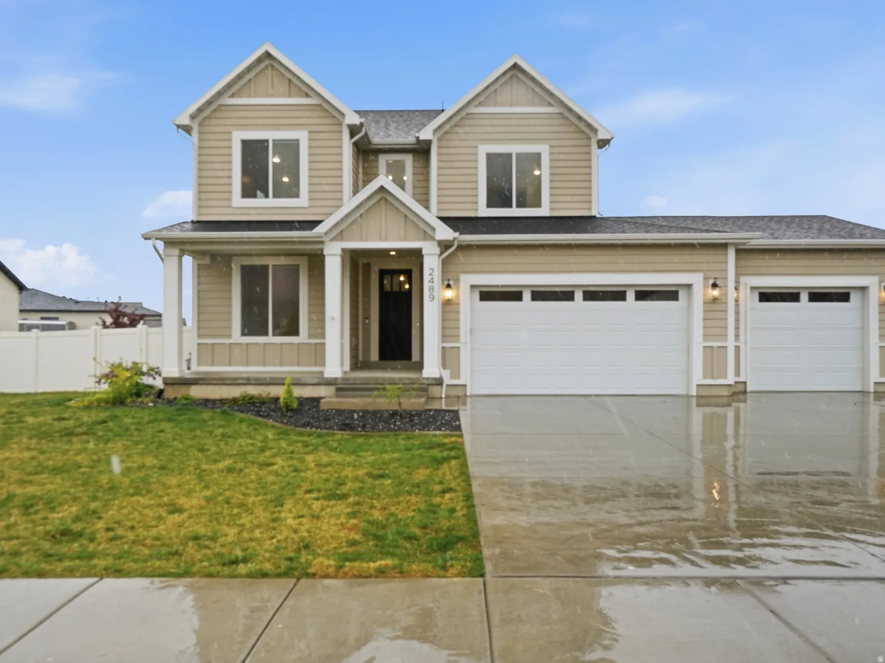 Craftsman inspired home with driveway, a porch, a garage, board and batten siding, and roof with shingles