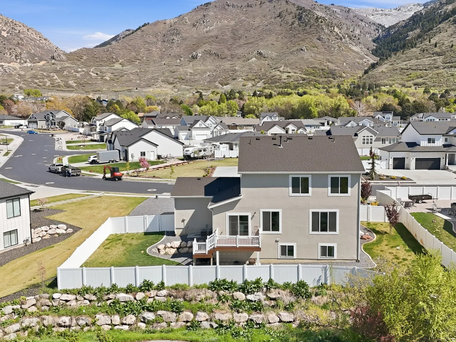 Aerial perspective of suburban area with a mountain backdrop