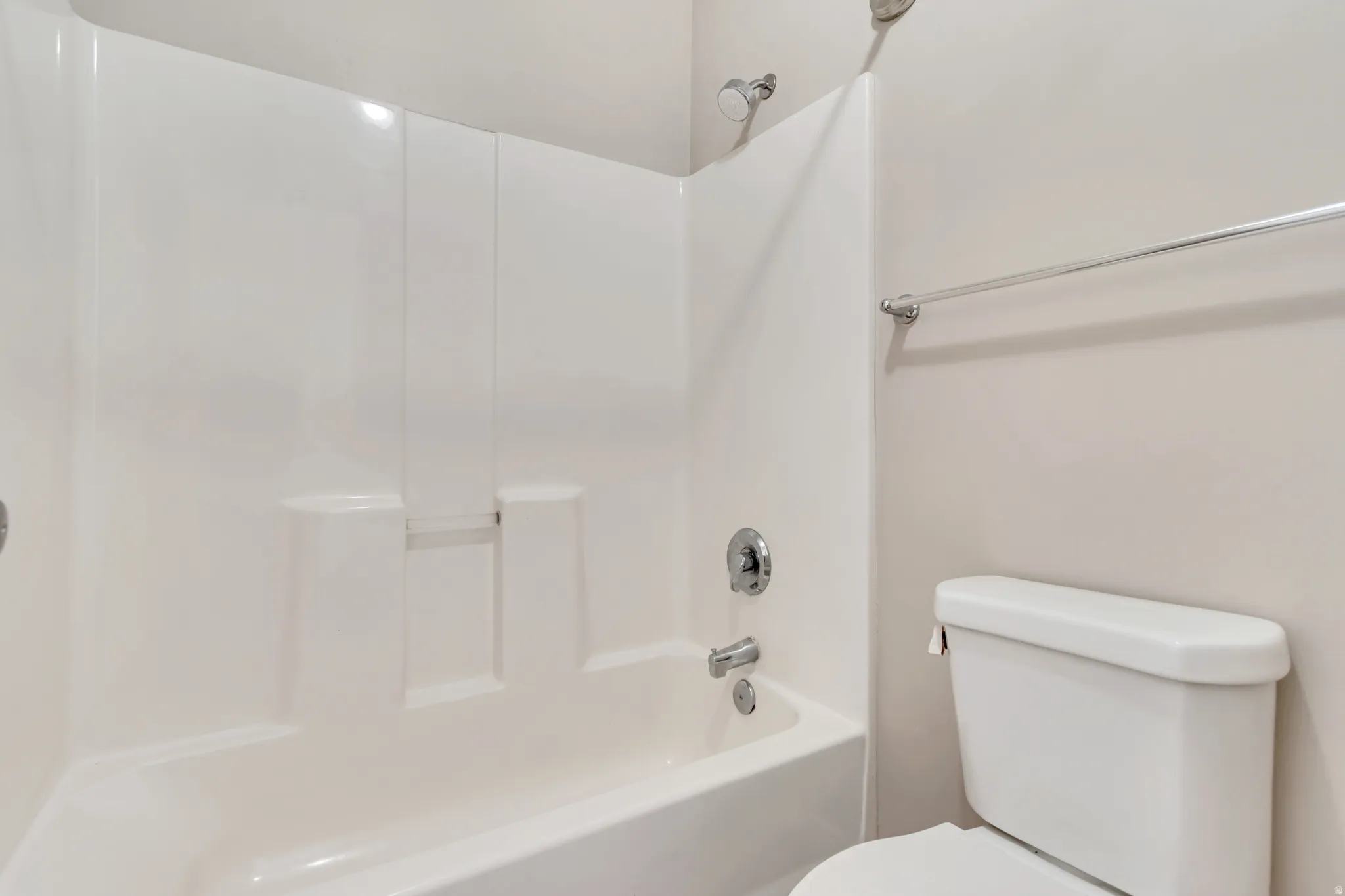 Full bathroom with toilet and shower / tub combination