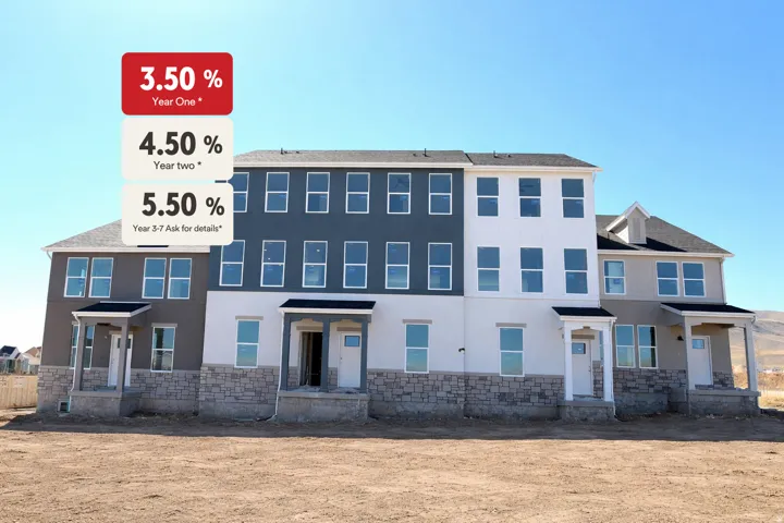 View of front of house with stone siding and stucco siding