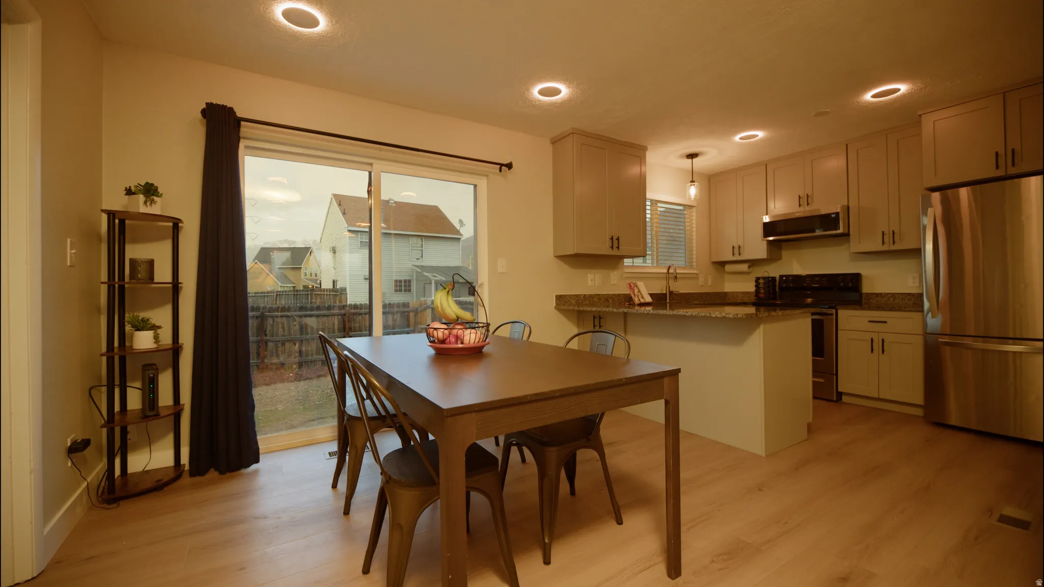 Dining room featuring light wood-style flooring and recessed lighting