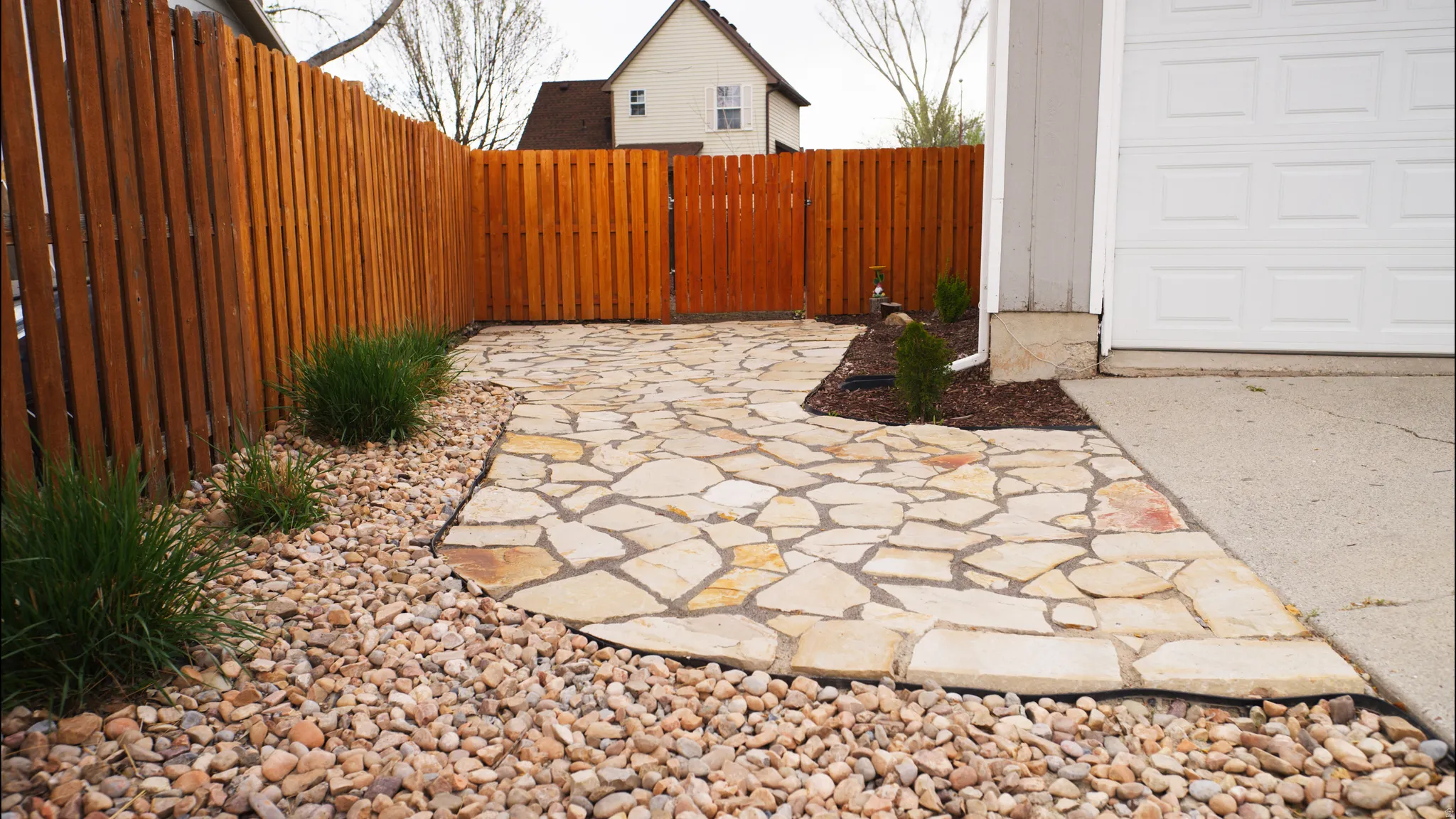 View of patio featuring a gate