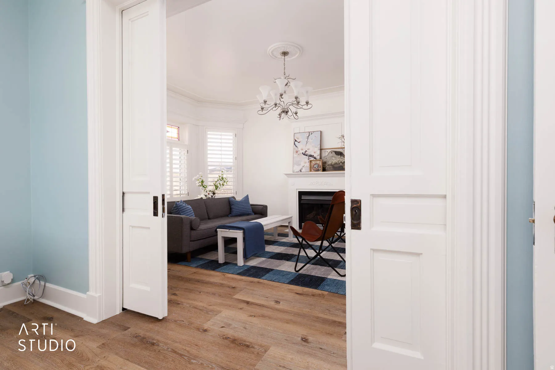 Looking out of the Living Room (The Parlour) to the Great Room showing the original pocket doors