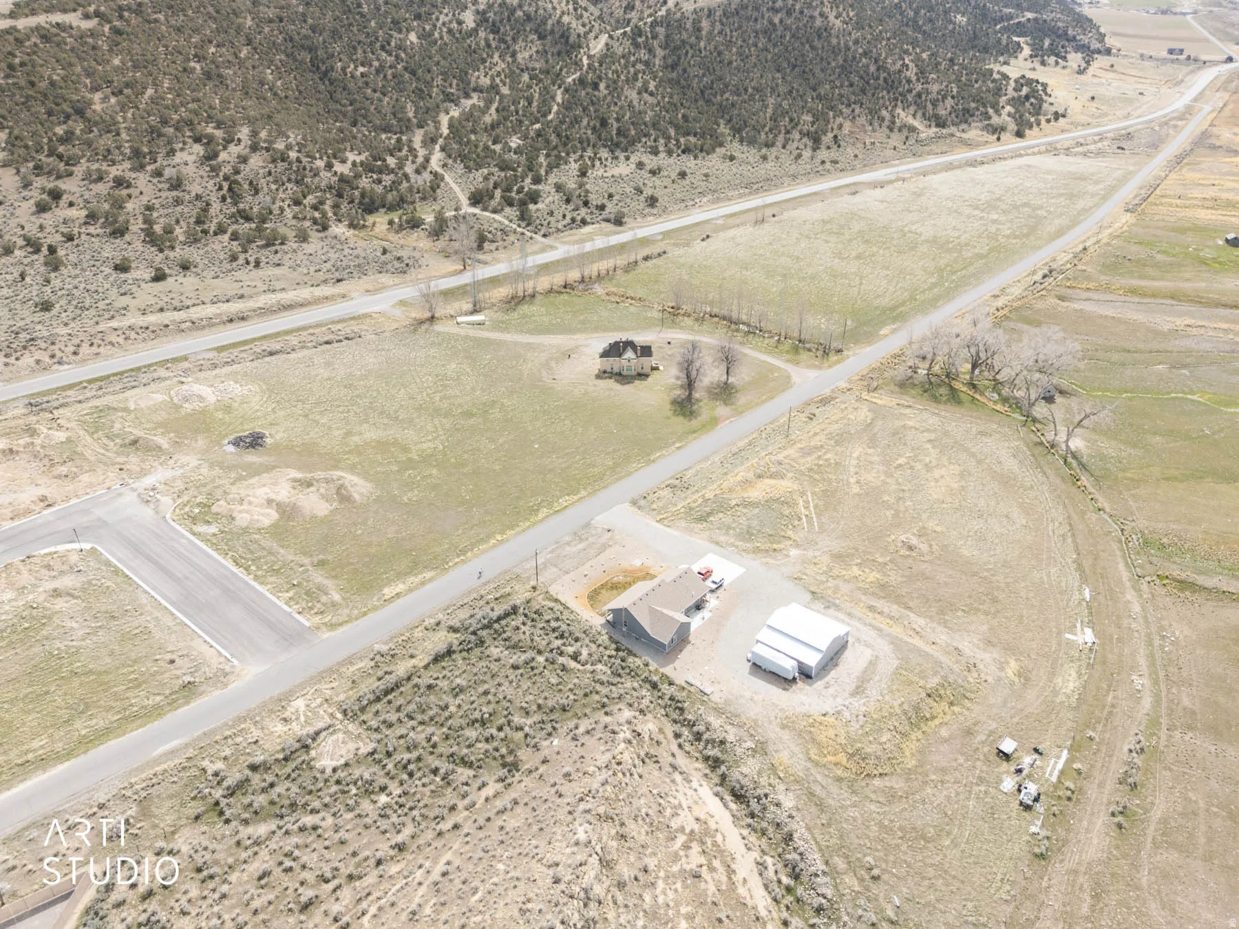Aerial view of property and surrounding area from the northwest corner