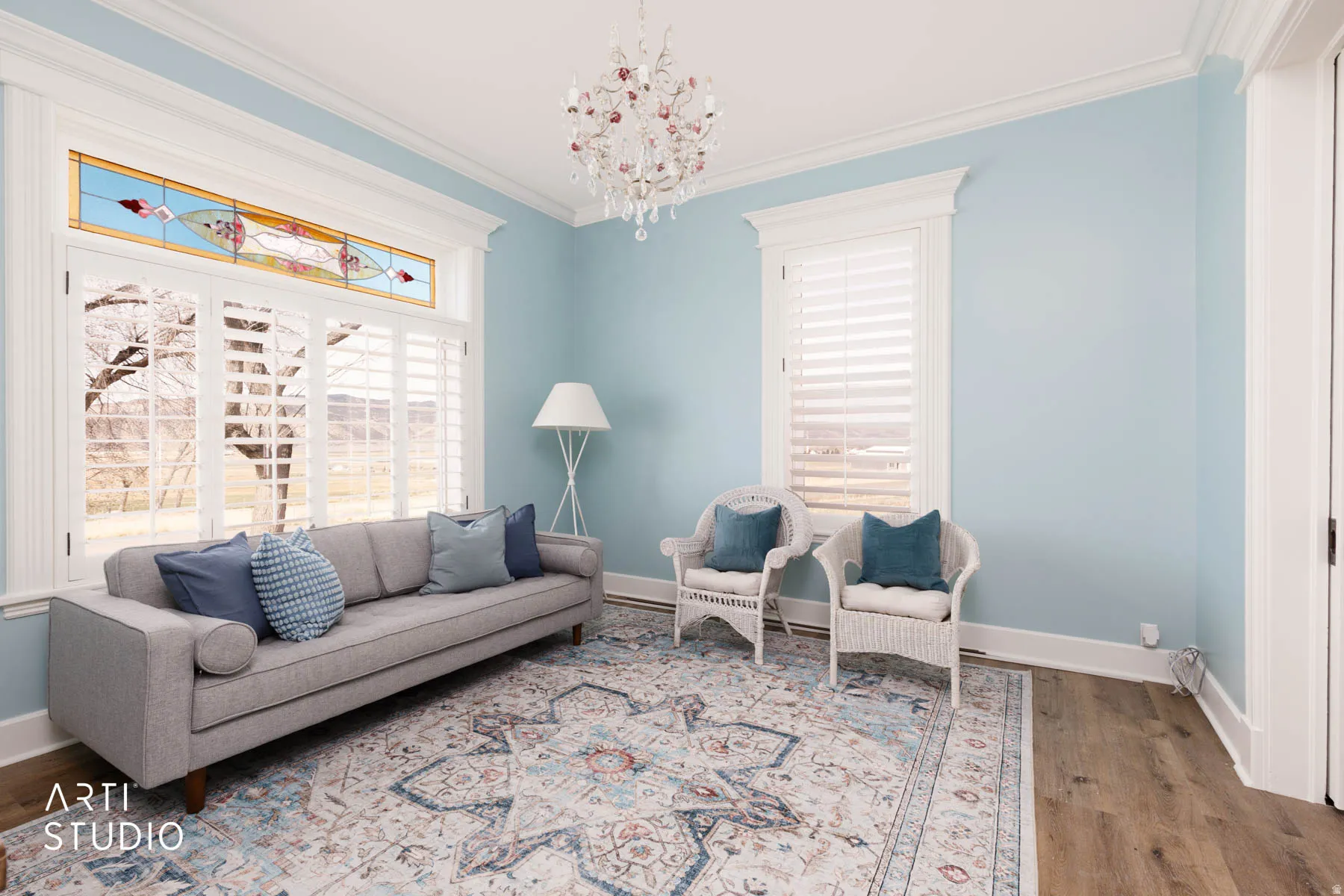 Living room (the Parlour)  with ornamental molding, crystal chandelier.
