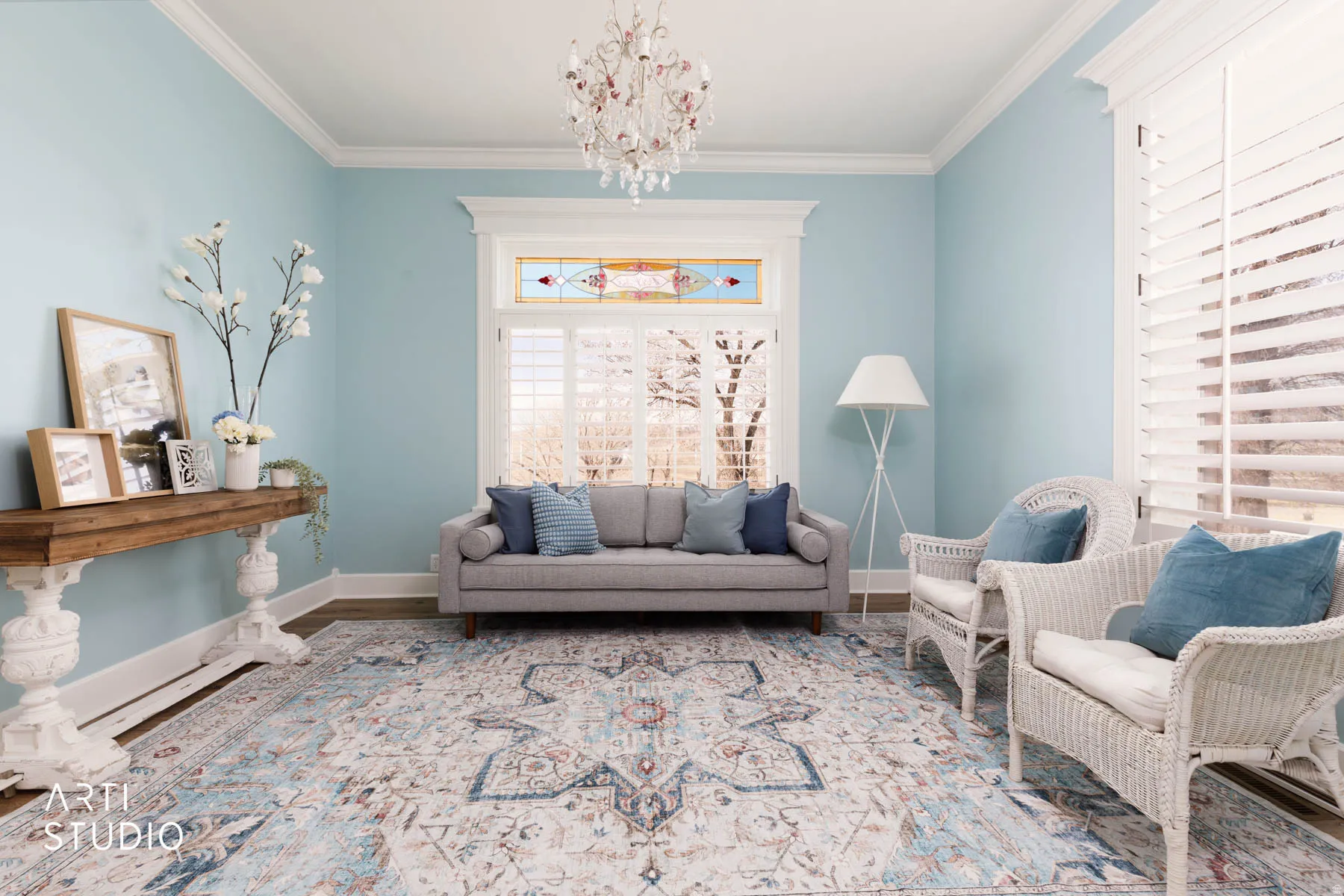 Living room (the Parlour)  with ornamental molding, crystal chandelier.