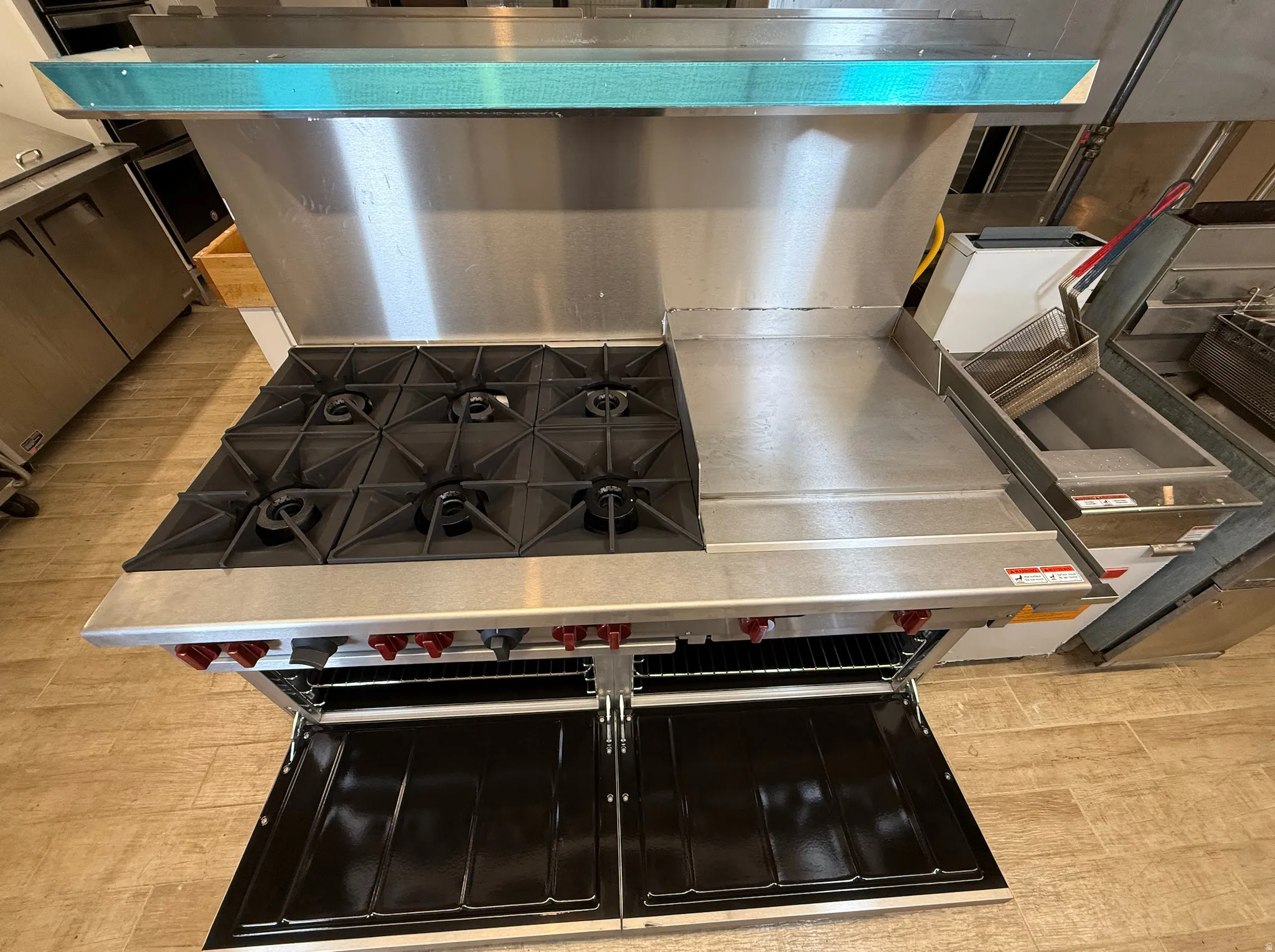 Kitchen featuring double oven range