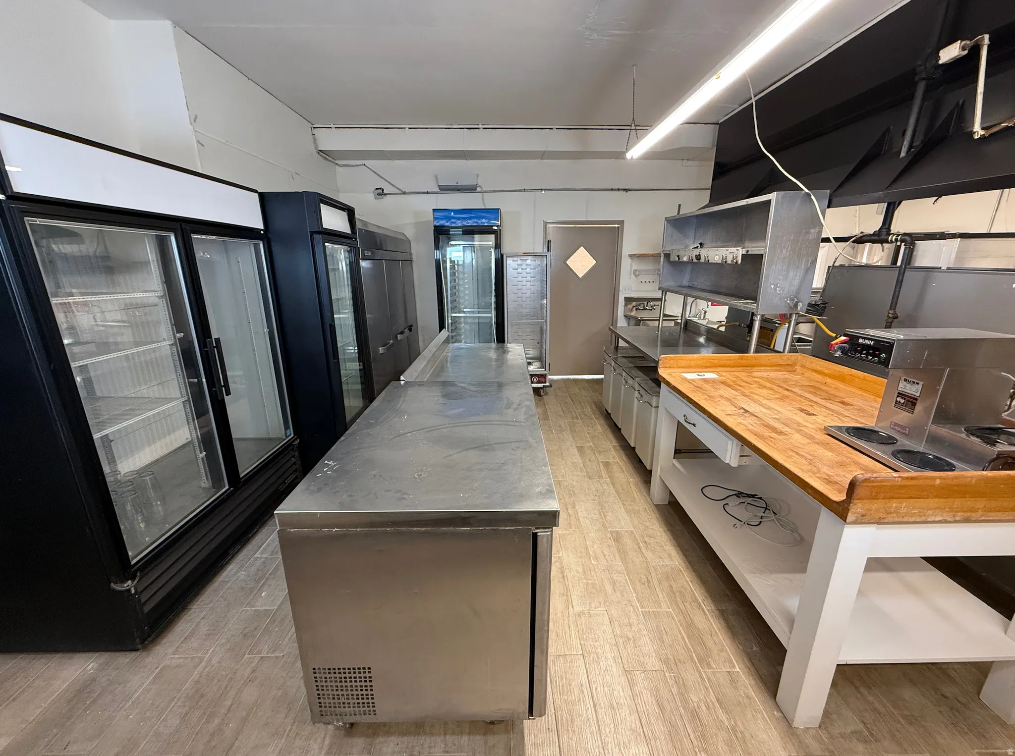Kitchen featuring stainless steel countertops and a center island