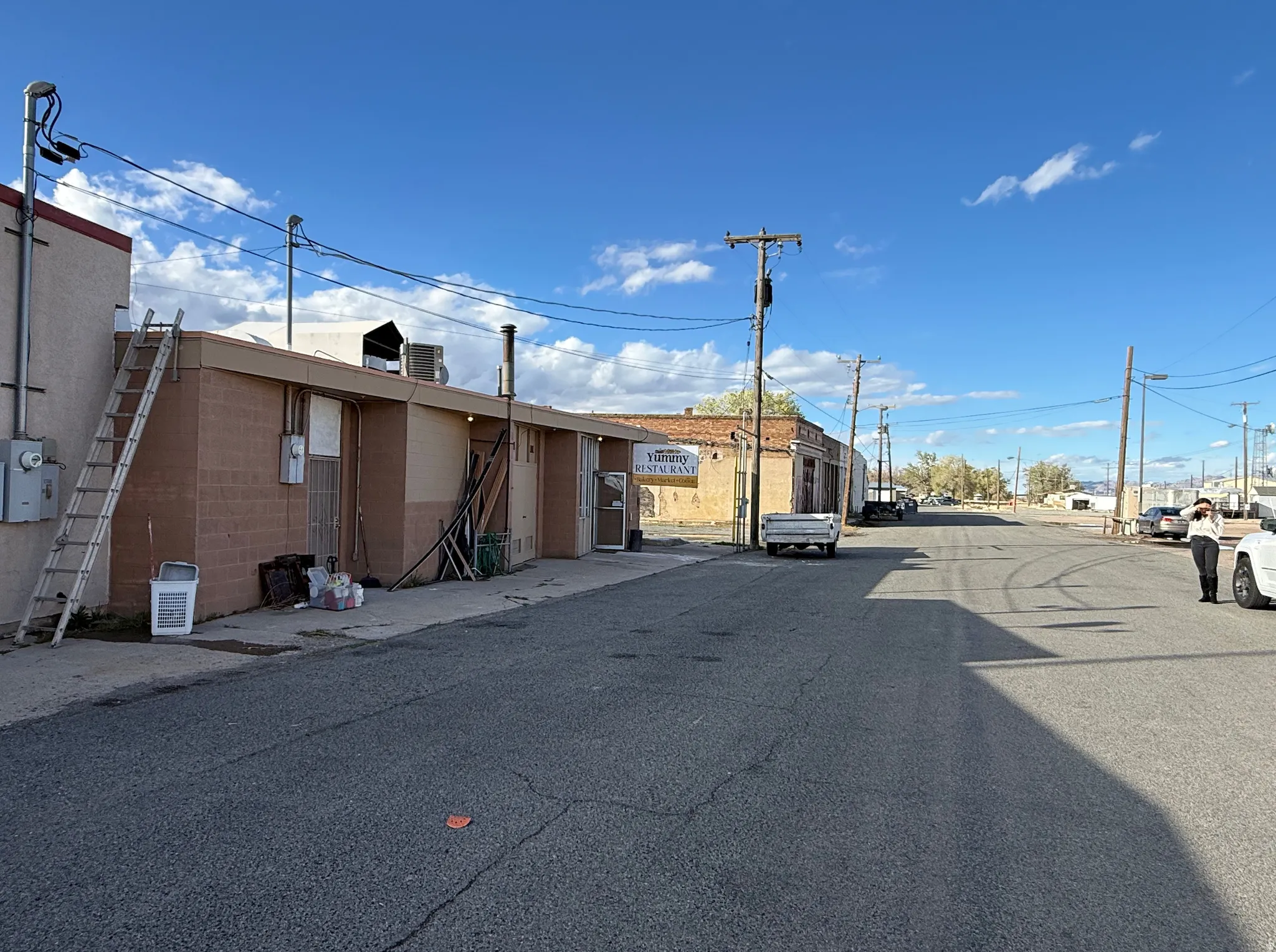 View of asphalt street with street lights