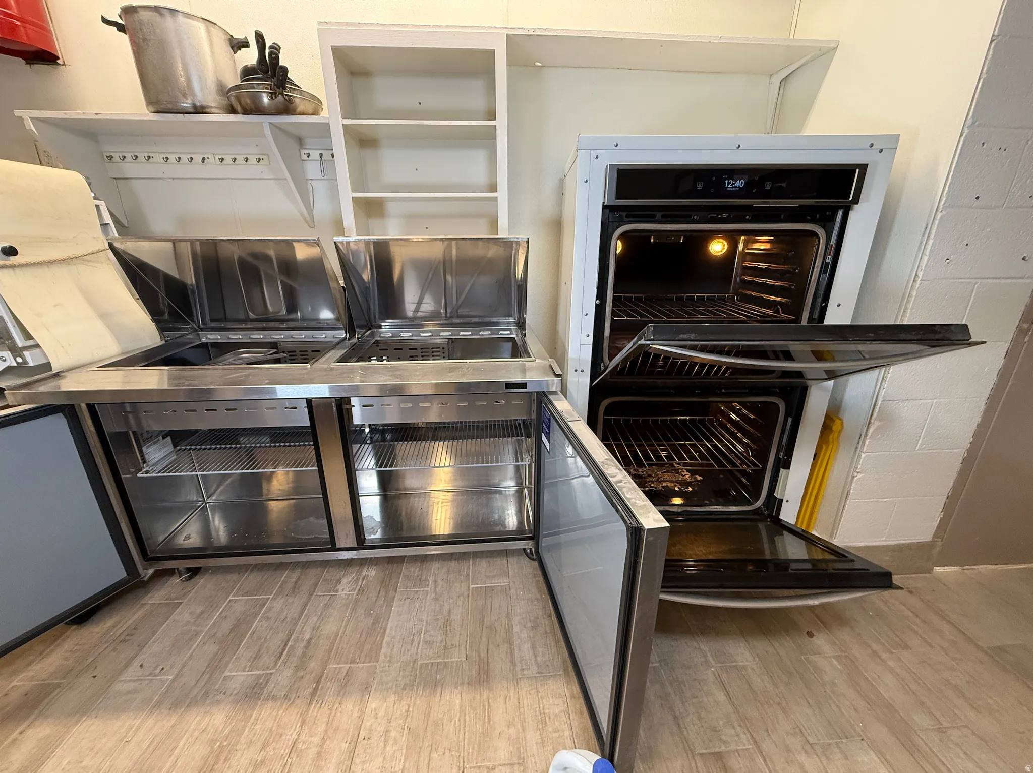 Kitchen view of light wood finished floors