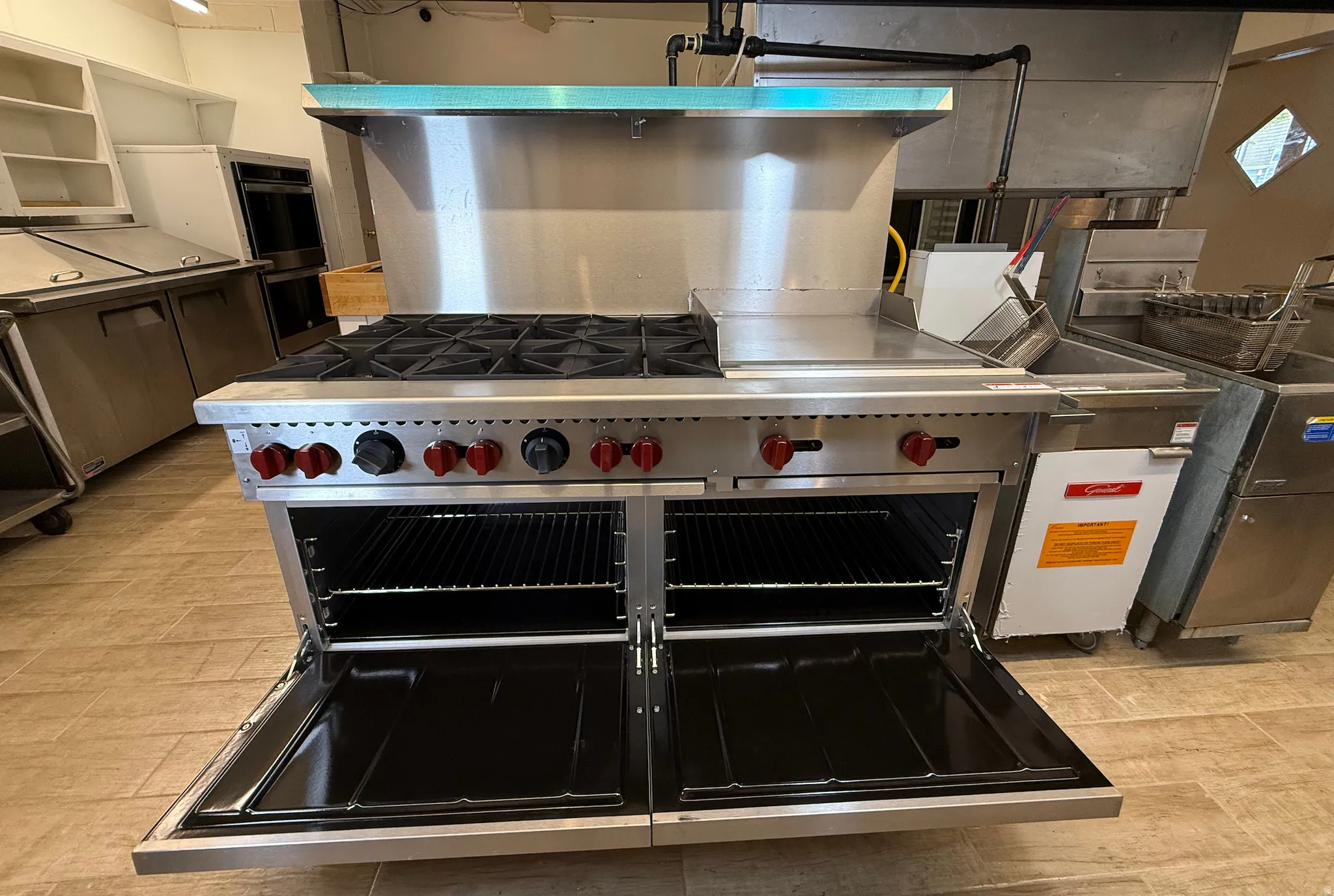 Kitchen featuring stainless steel countertops and stainless steel appliances