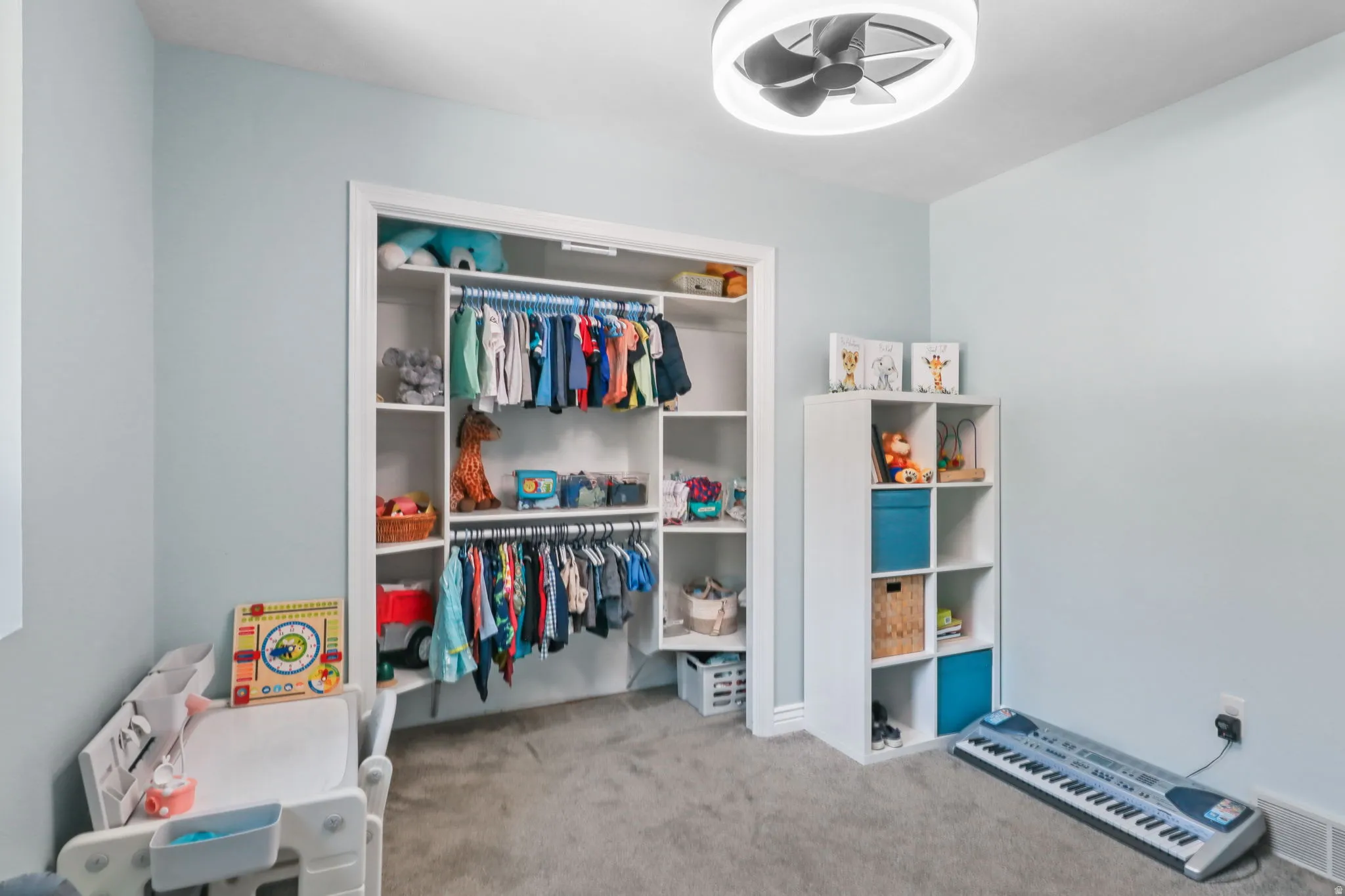Bedroom with light carpet