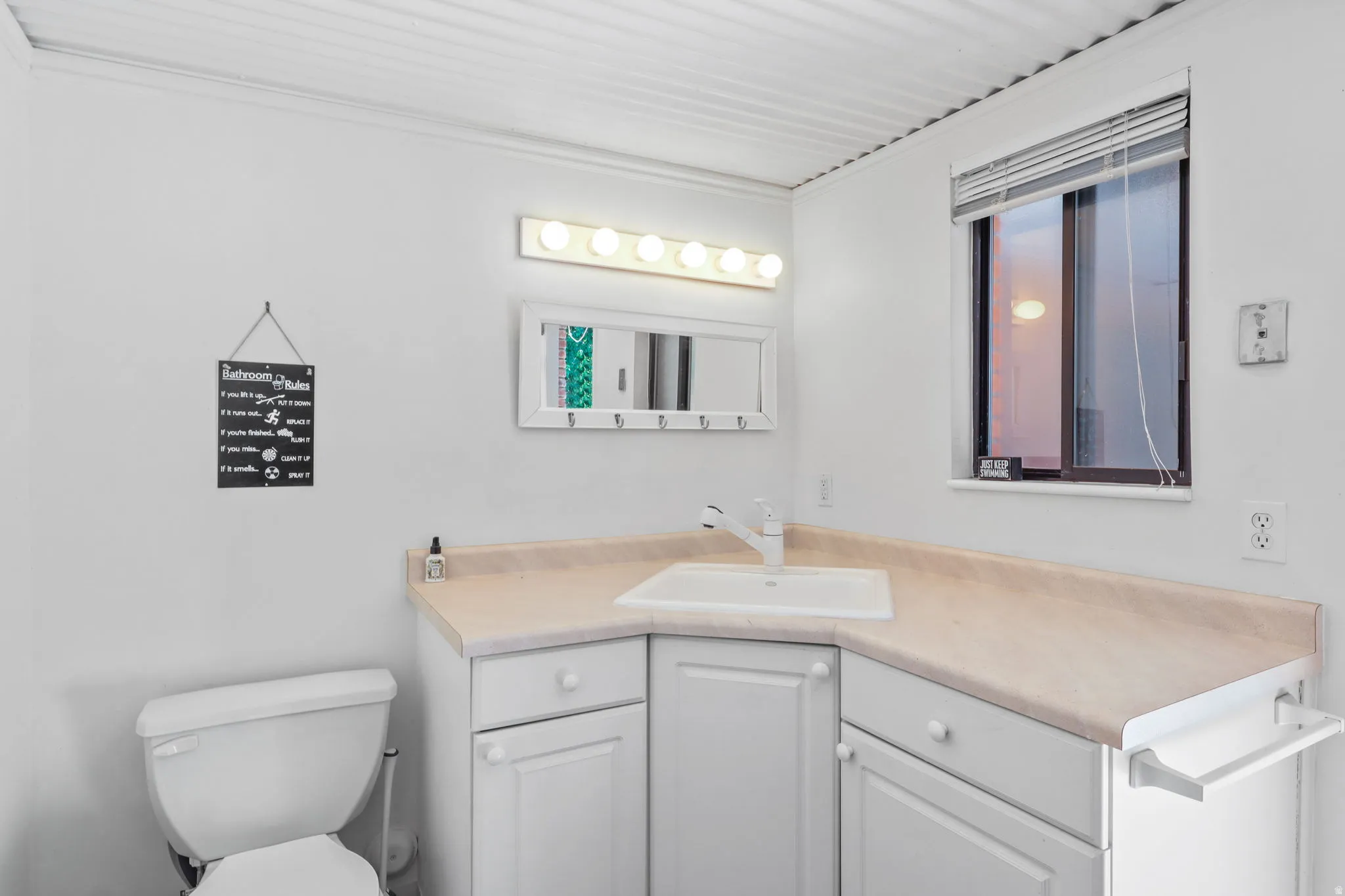 Half bath with vanity and ornamental molding