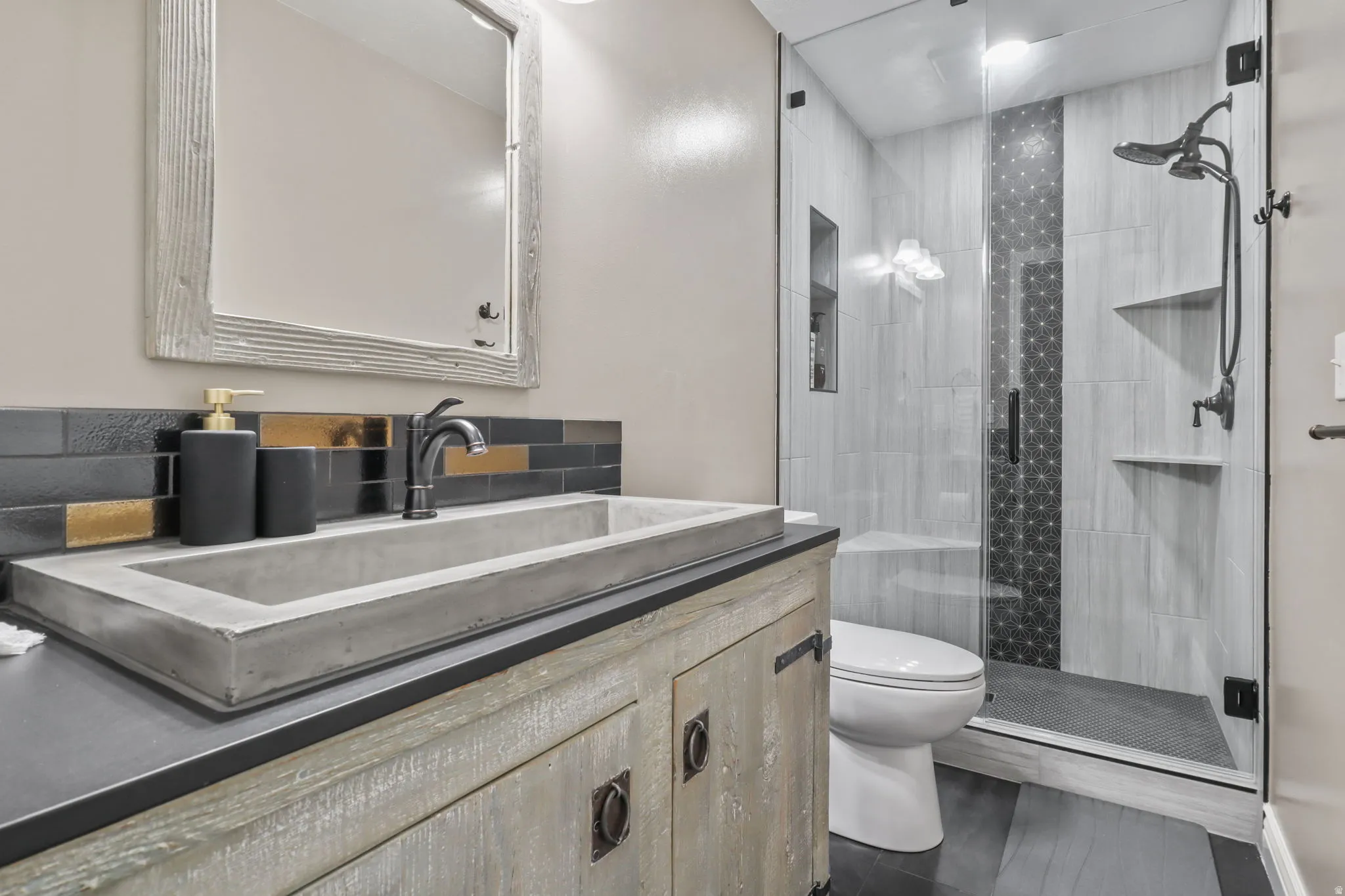 Bathroom with vanity and a stall shower