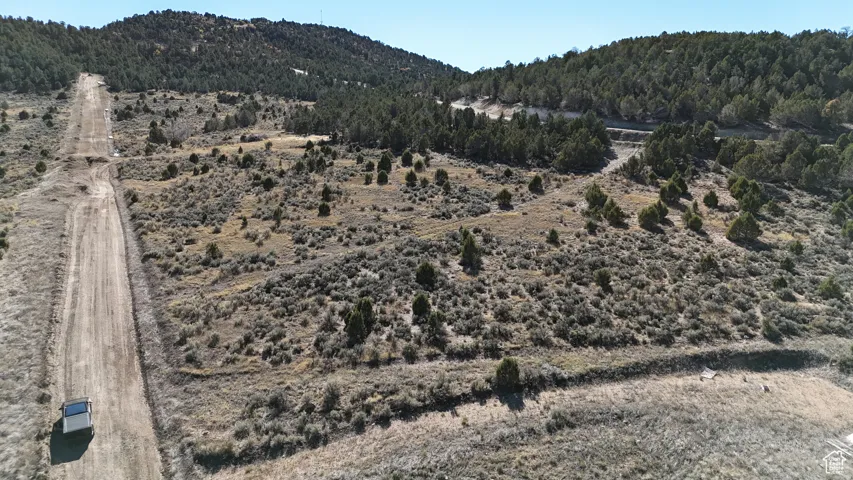 View of mountain background featuring rural landscape