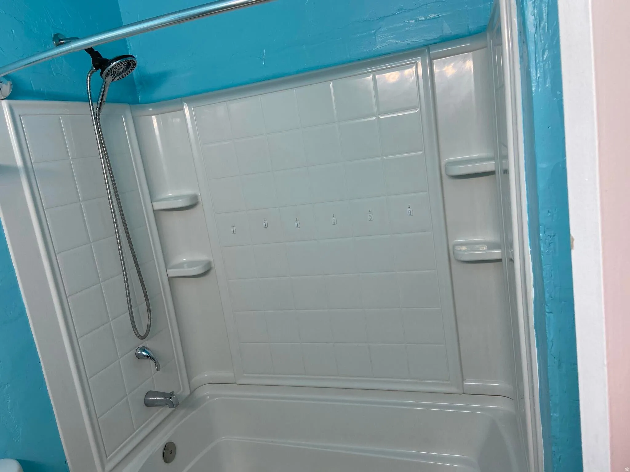 Bathroom featuring shower / washtub combination