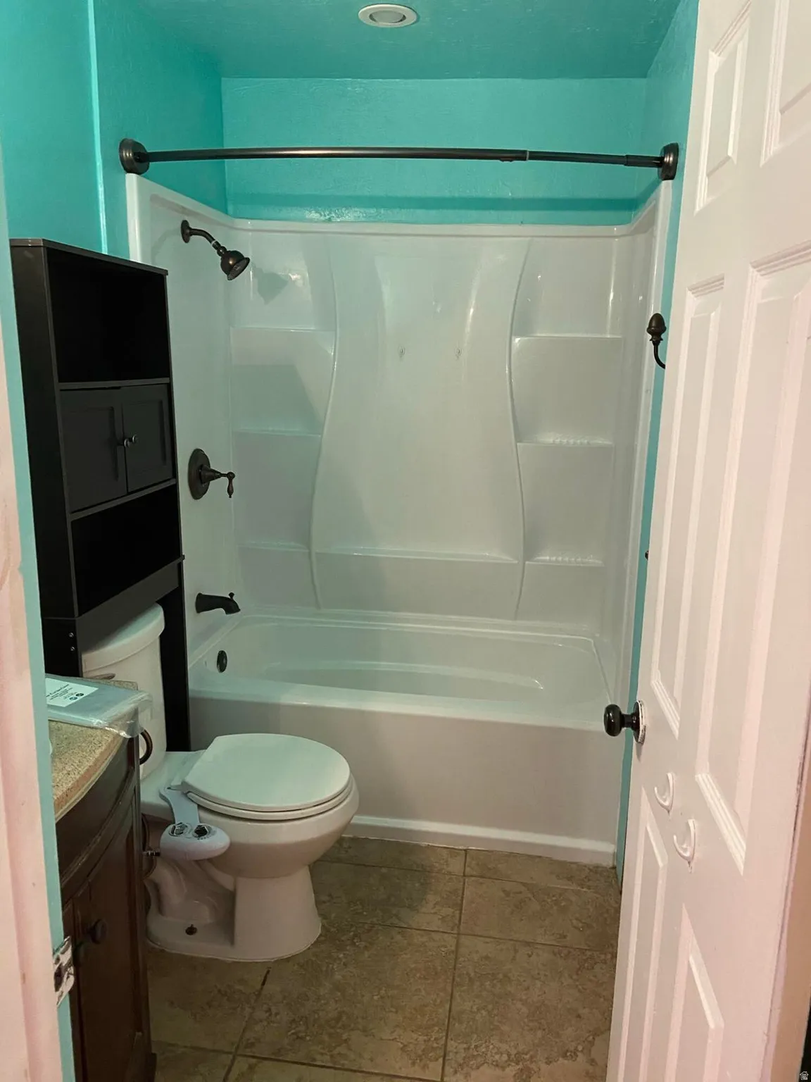 Full bathroom with vanity and  shower combination