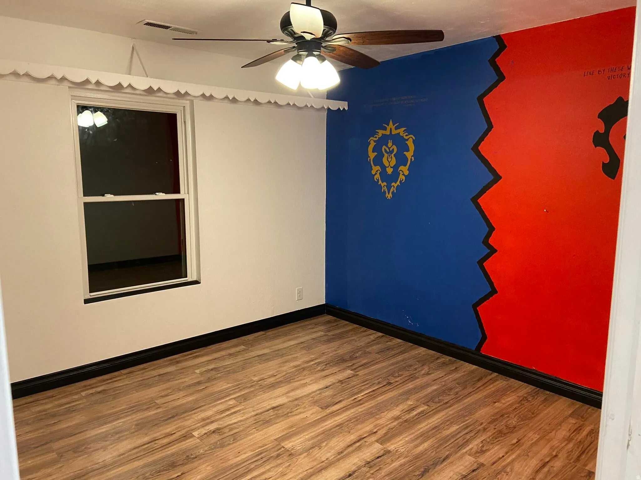 Spare room with ceiling fan and wood finished floors