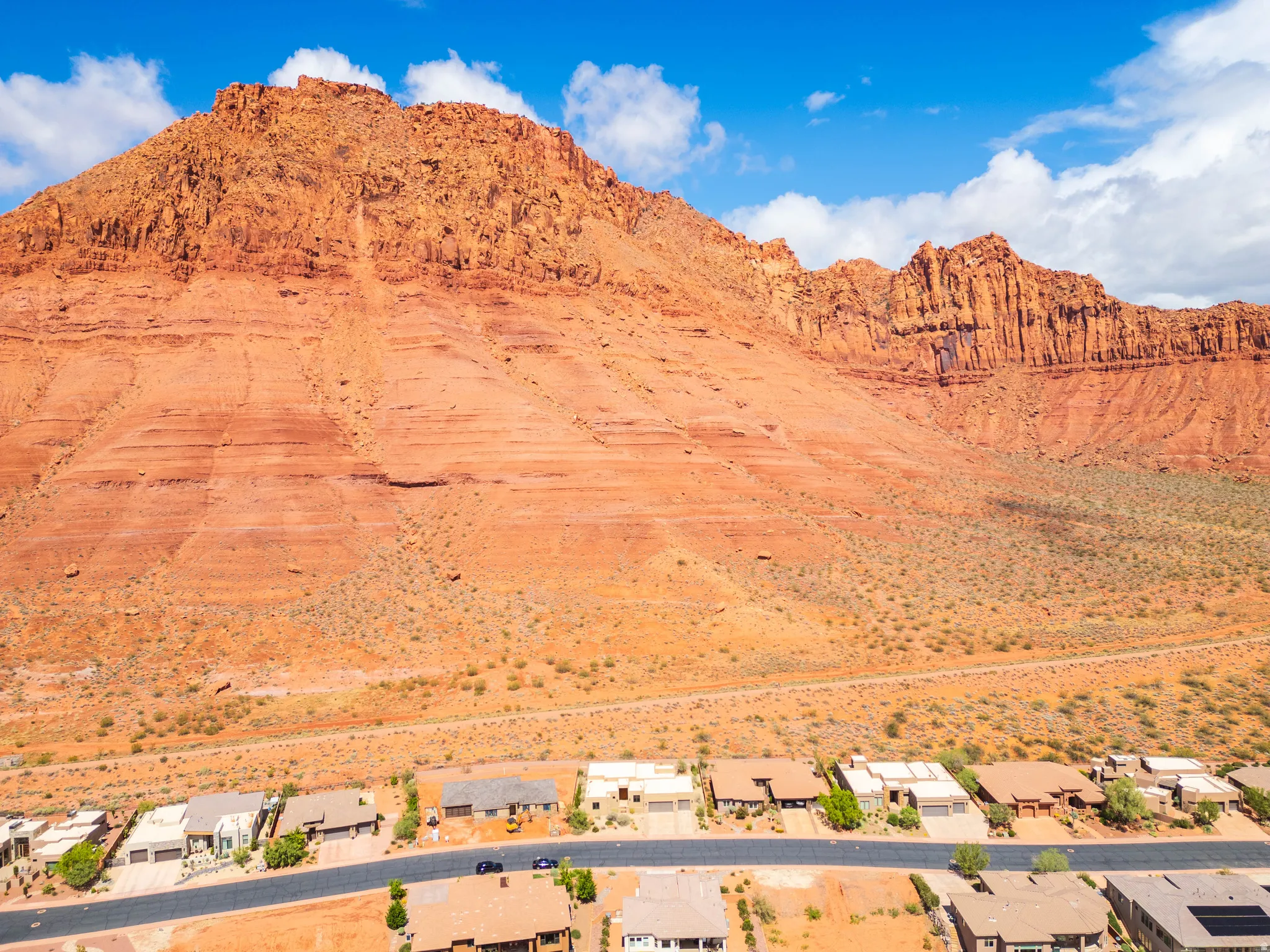 View of mountain backdrop featuring a desert landscape and nearby suburban area