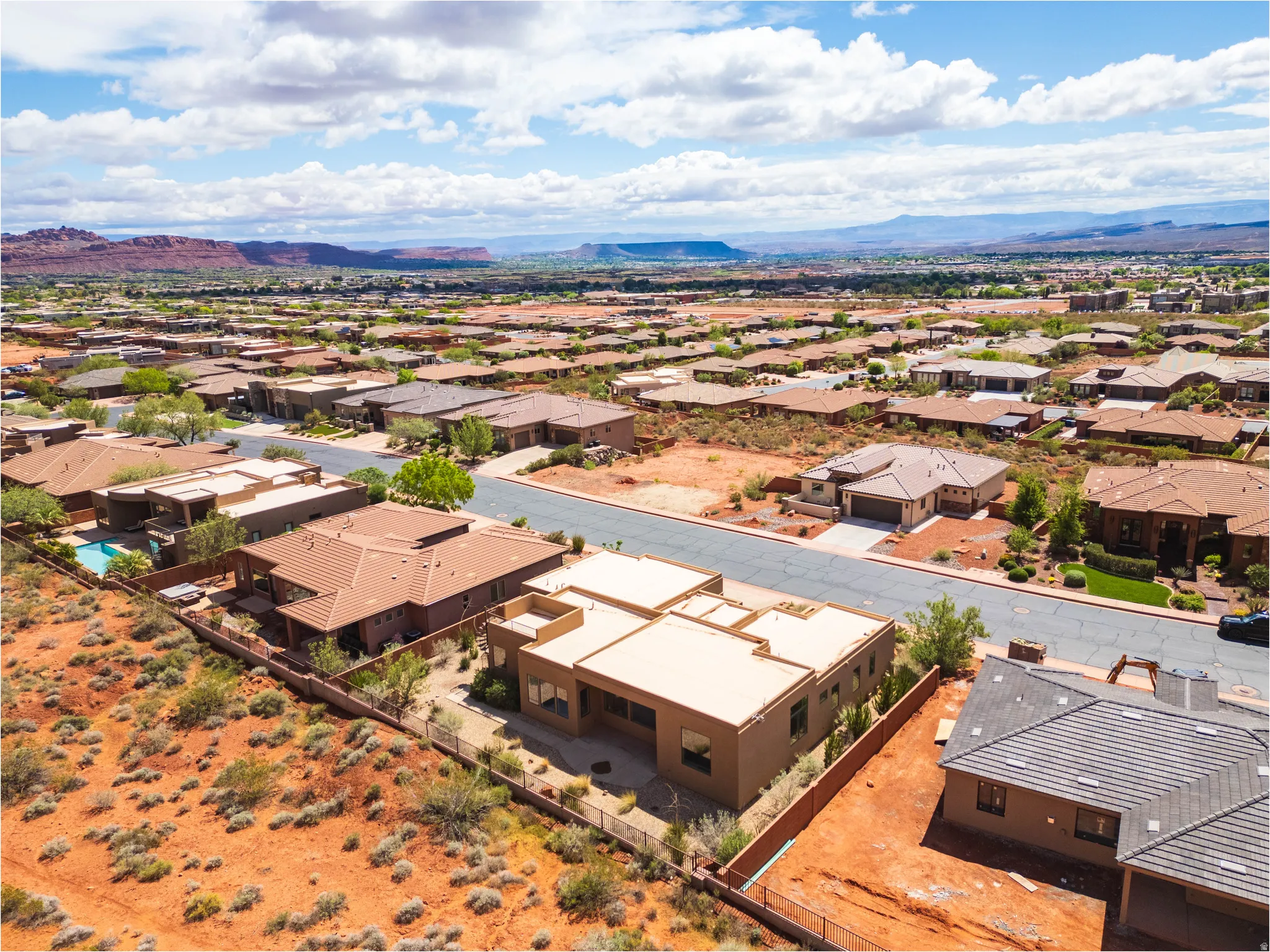 Aerial view of residential area with a mountain backdrop