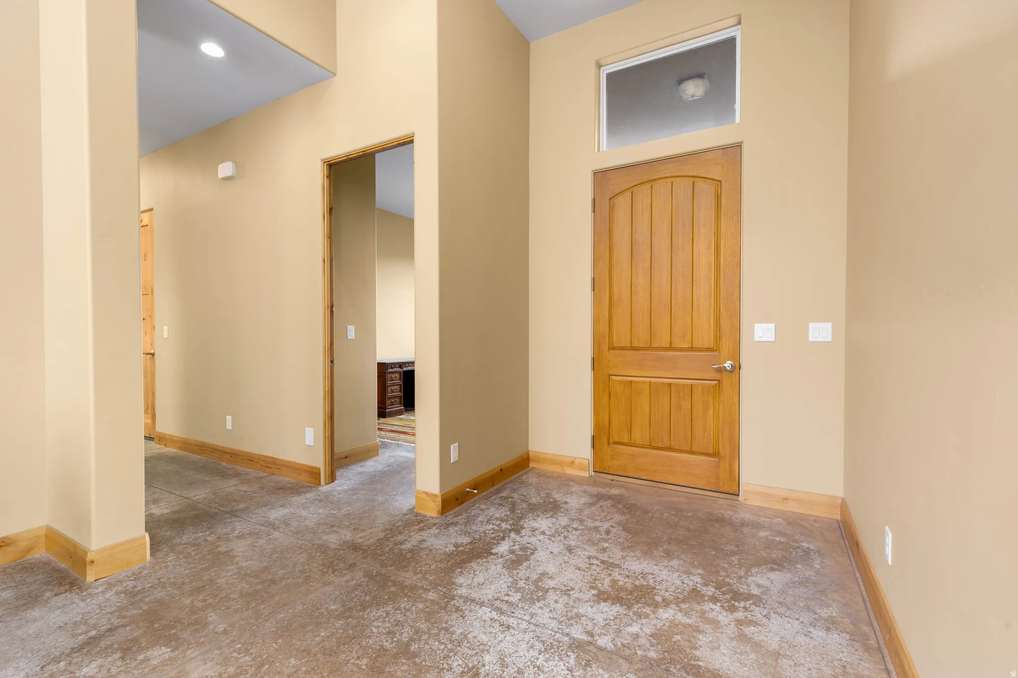 Entrance foyer featuring recessed lighting and baseboards