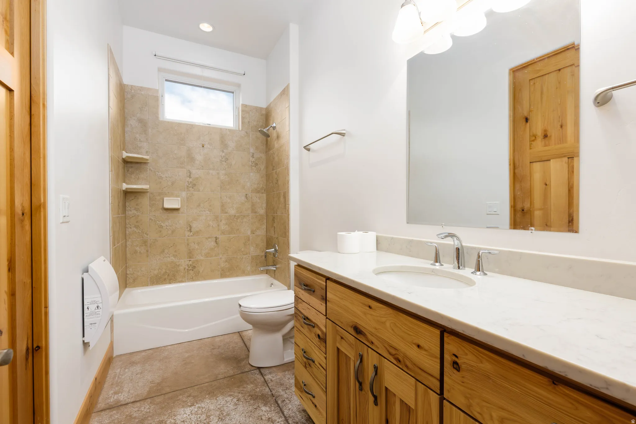 Full bath with vanity, shower / bathtub combination, and light tile patterned flooring