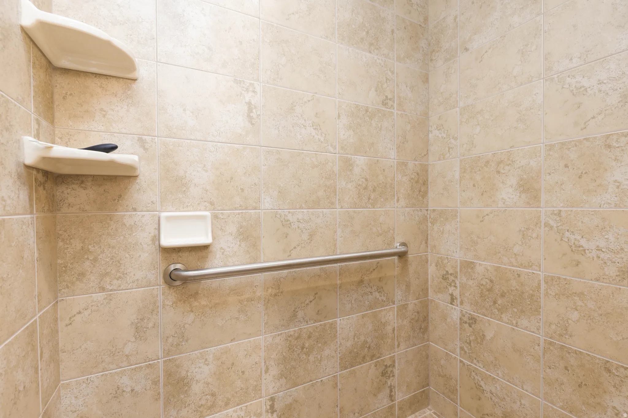 Bathroom featuring a tile shower