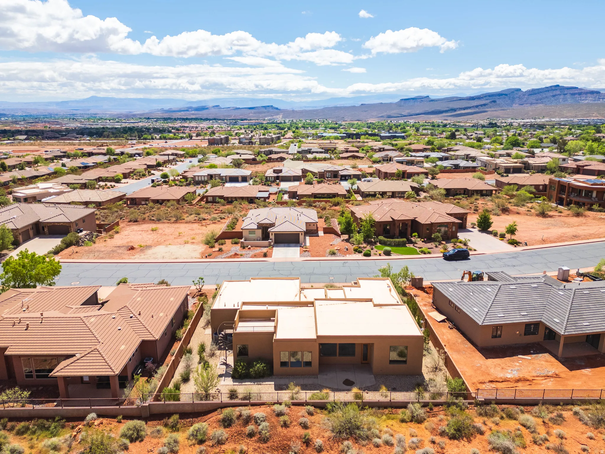 Aerial view of residential area featuring a mountain backdrop