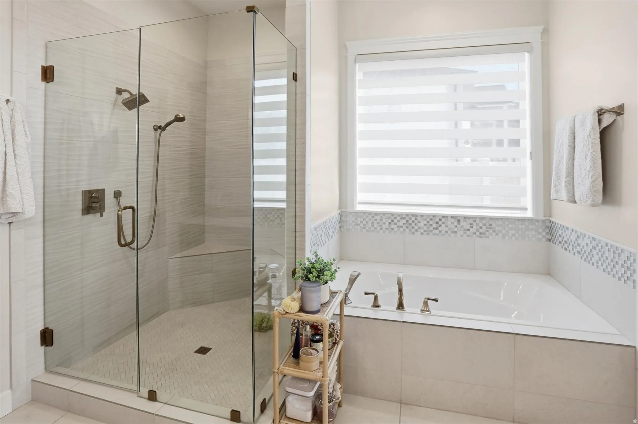 Full bathroom with a stall shower and a garden tub