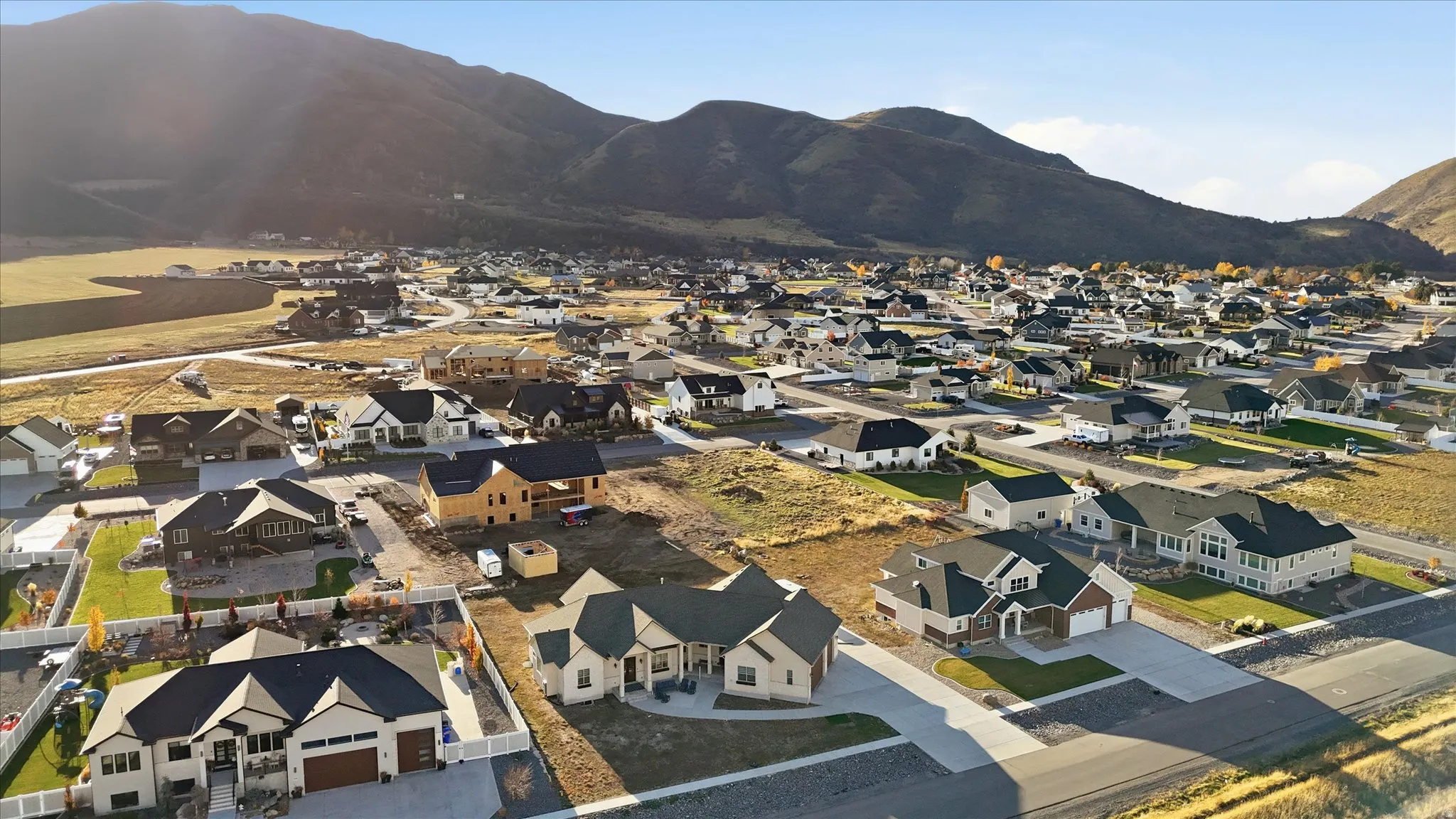 Aerial perspective of suburban area with a mountainous background