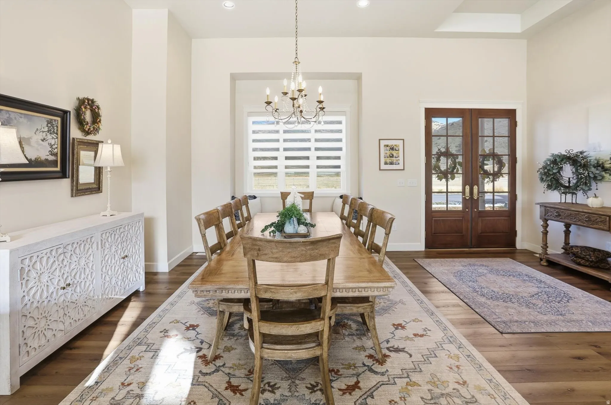 Dining area featuring french doors, plenty of natural light, and dark wood-type flooring