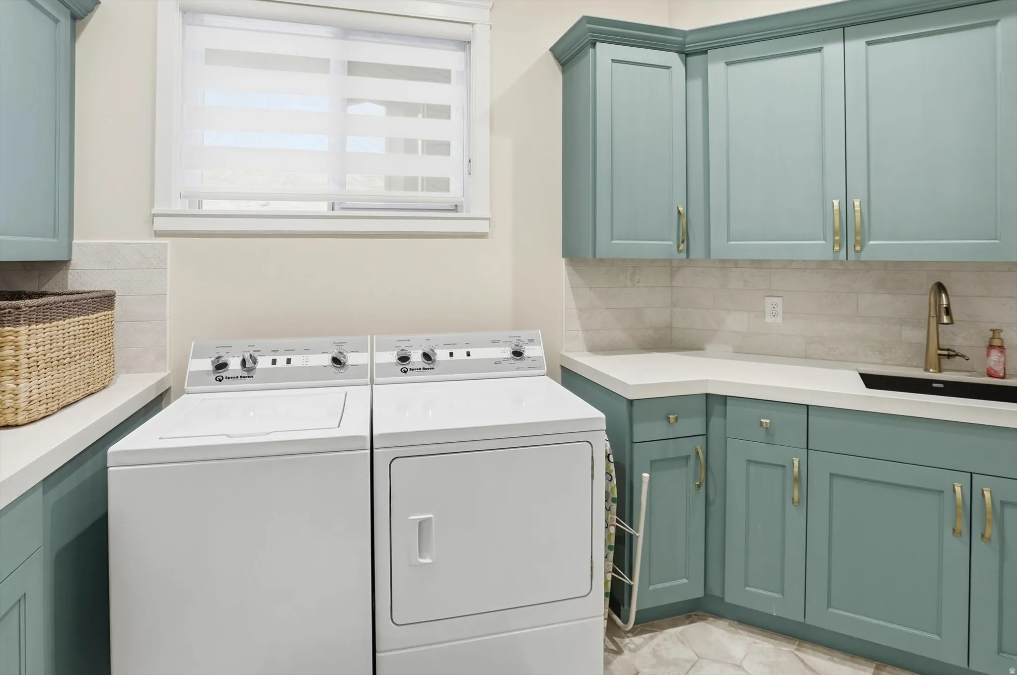 Laundry room featuring cabinet space and washer and dryer