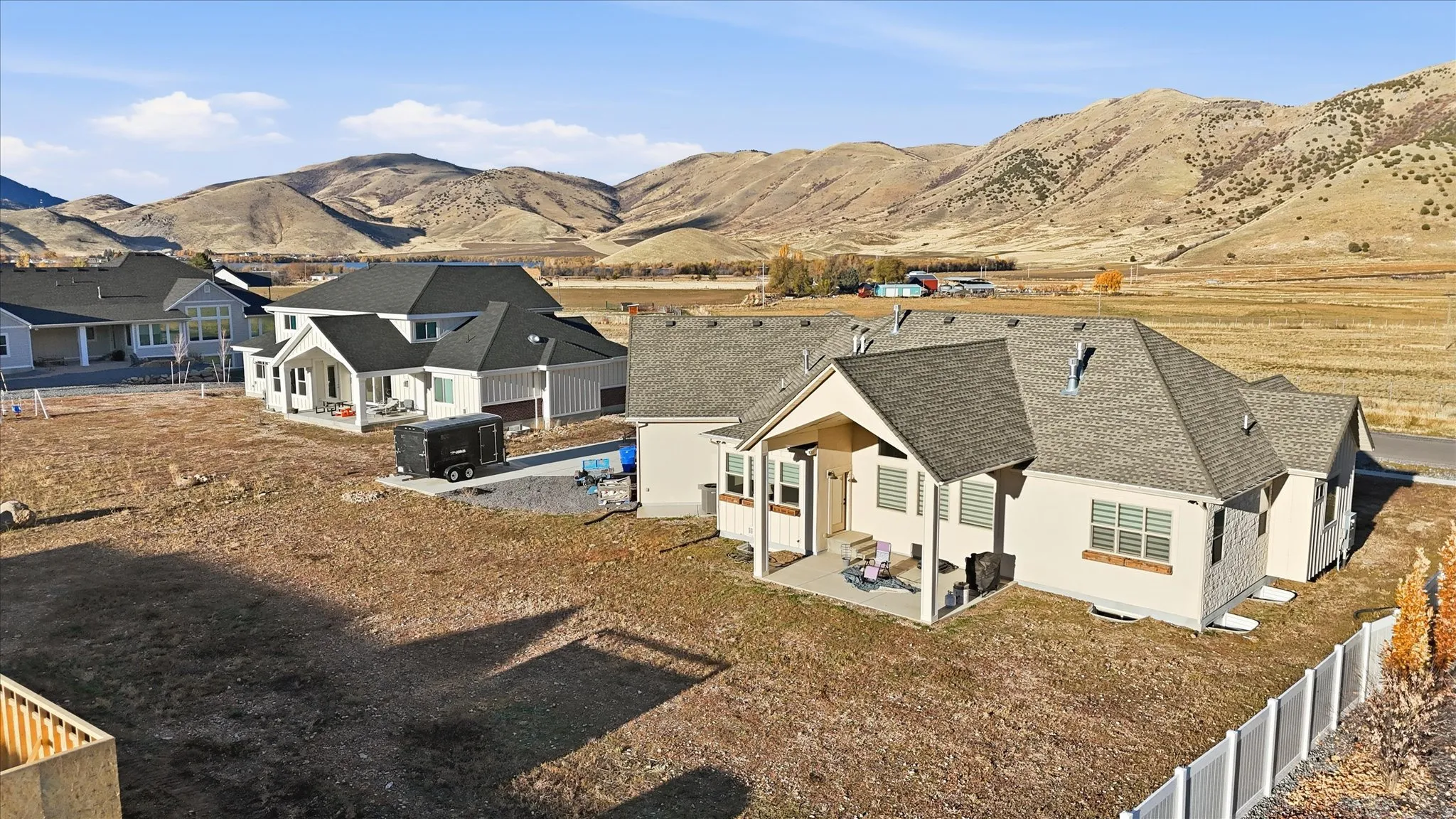 Aerial perspective of suburban area with a mountainous background