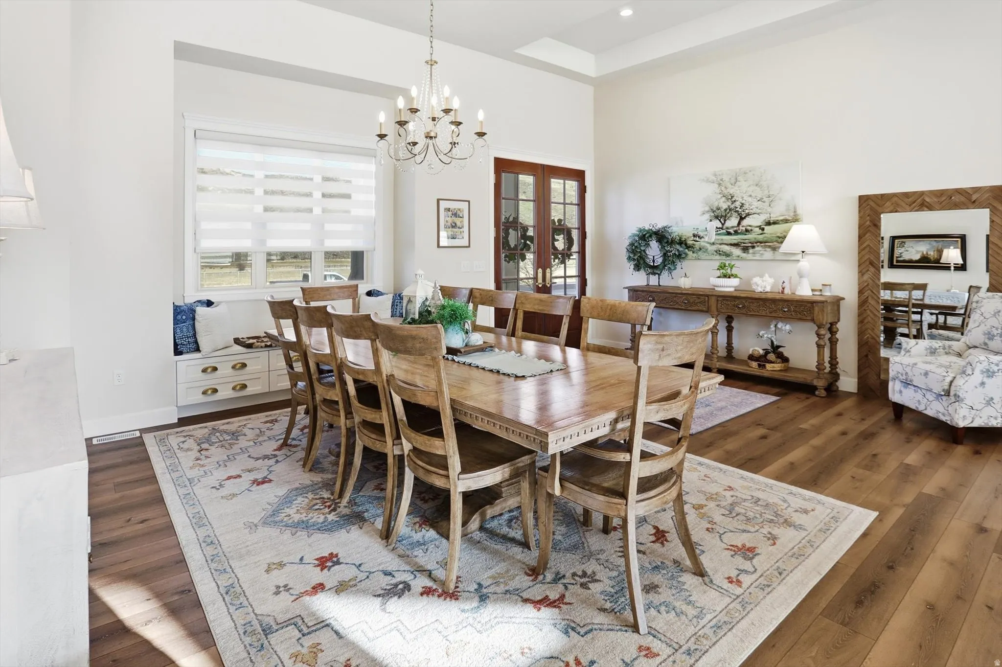 Dining room featuring a chandelier and dark wood-style floors