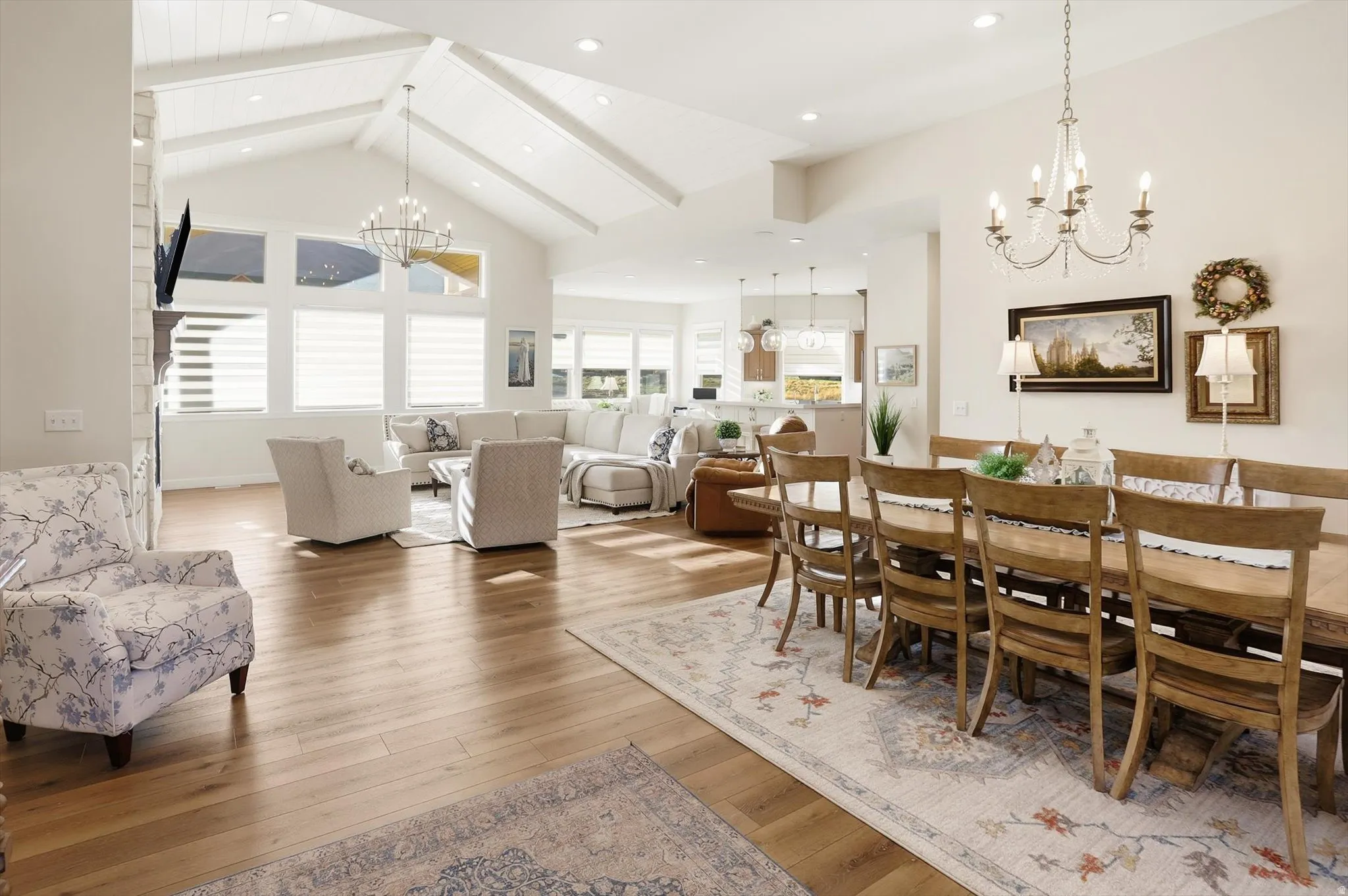 Dining area with hanging lights and light wood-style floors