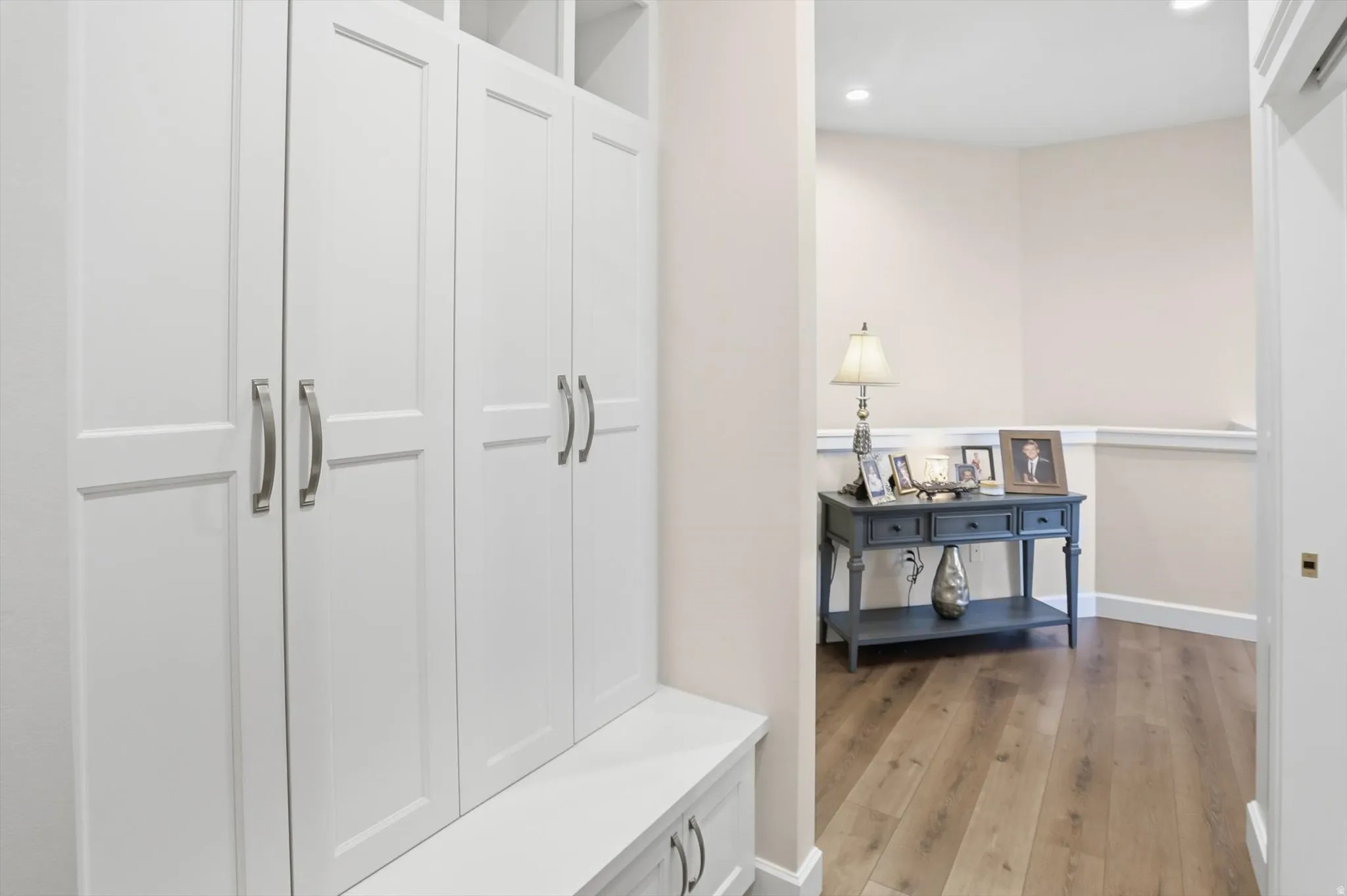 Mudroom with light wood-style flooring and recessed lighting