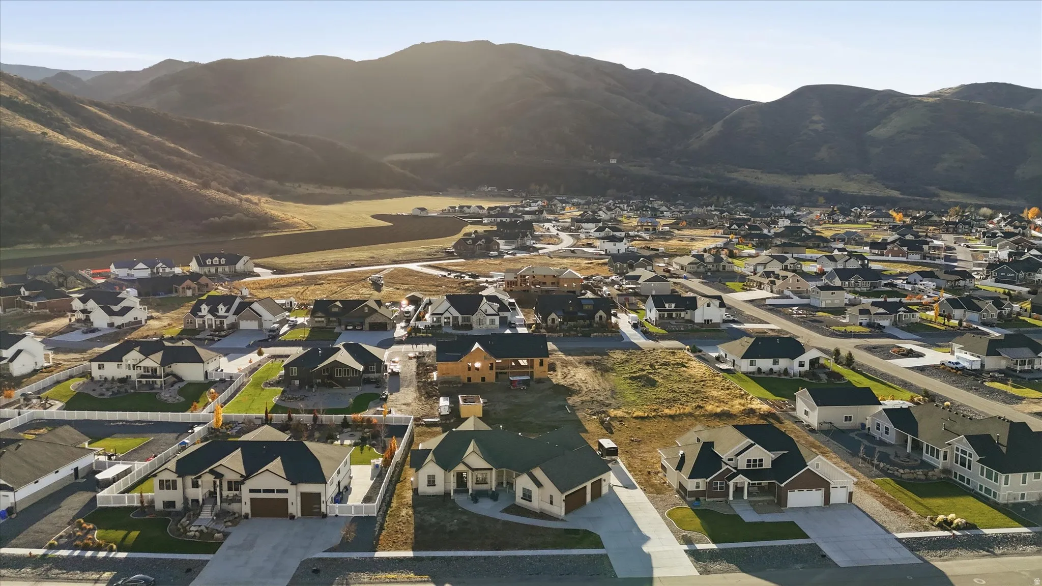Aerial view of residential area featuring mountains