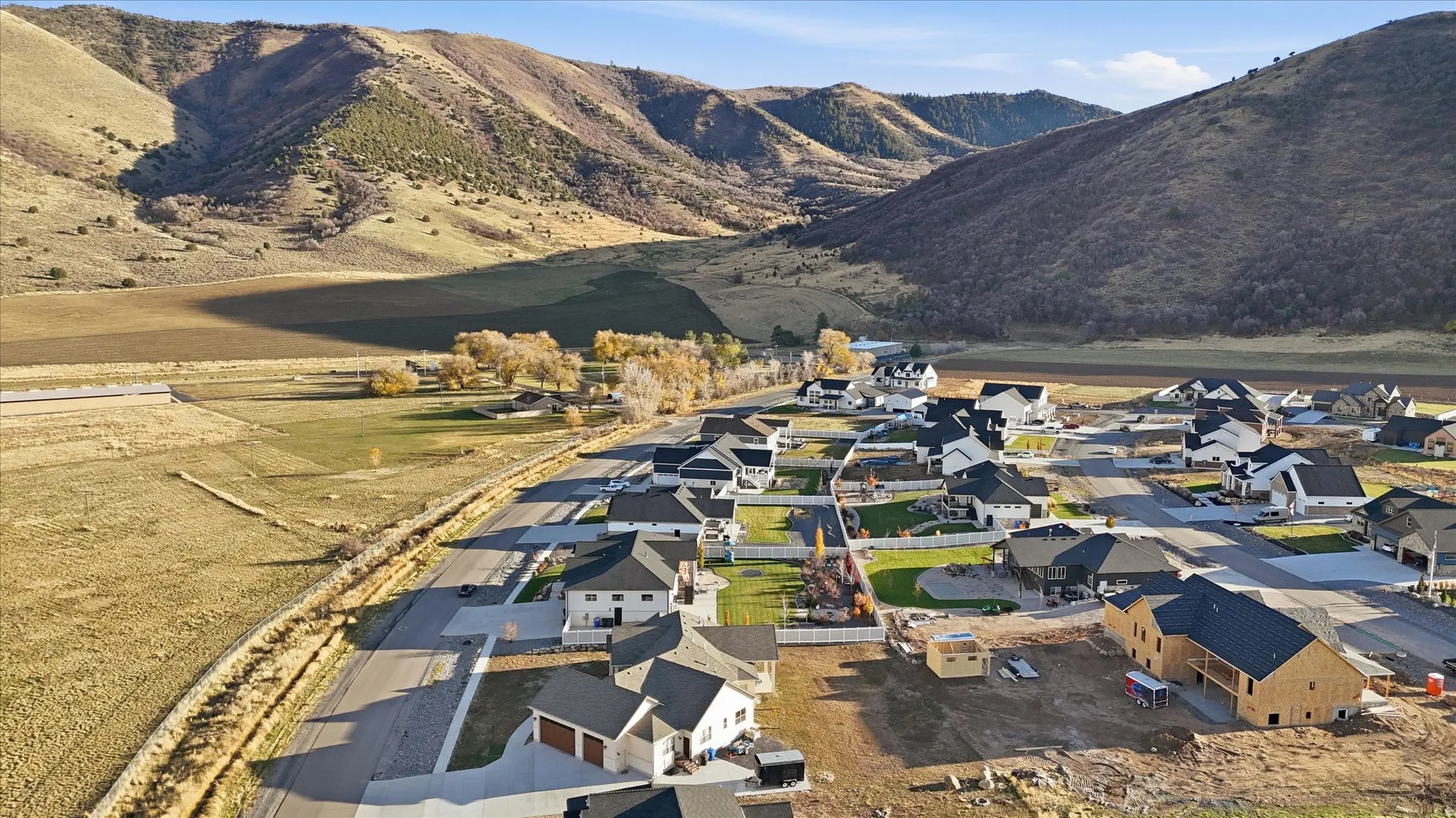 Aerial overview of property's location featuring mountains and nearby suburban area
