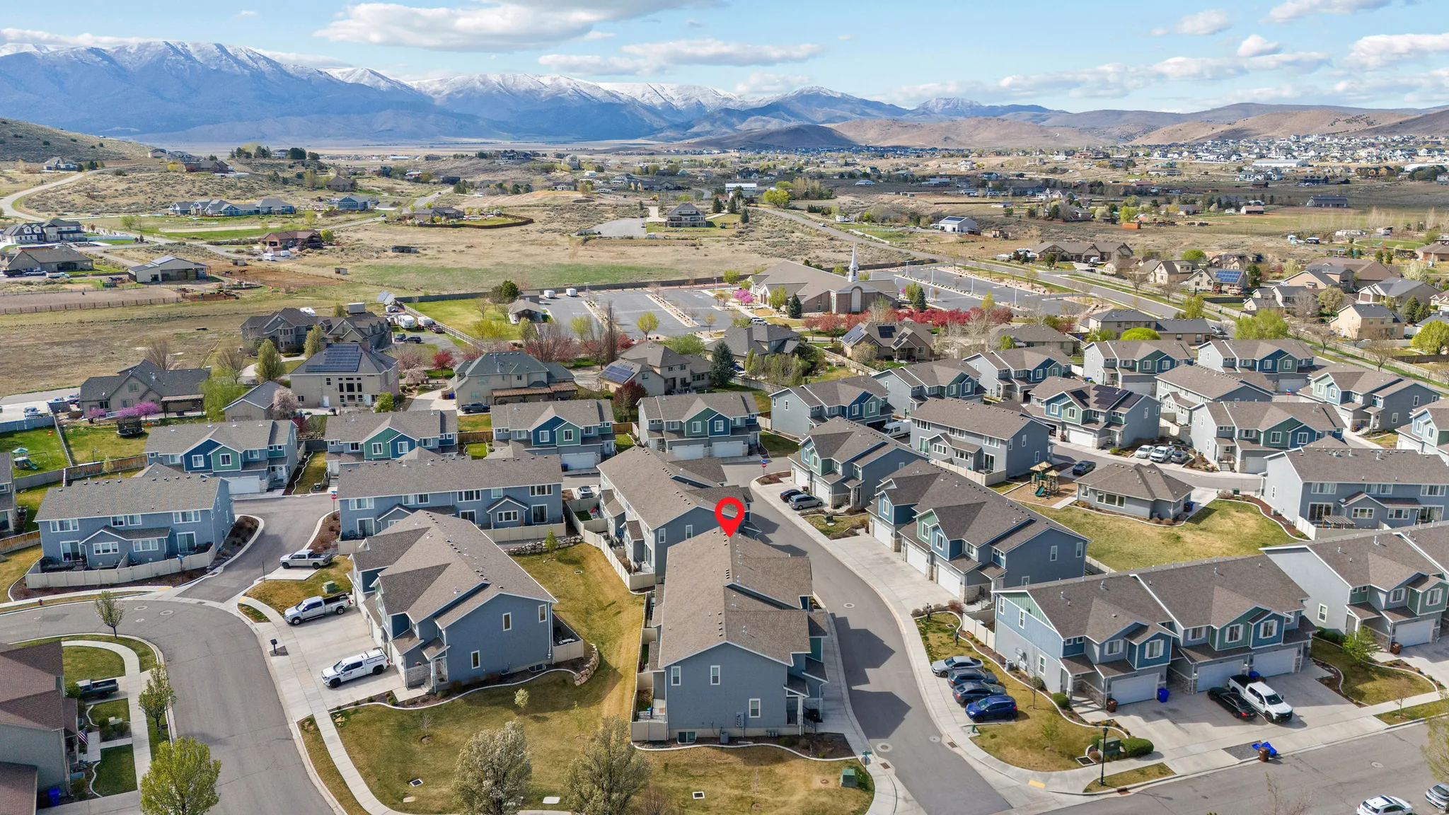 Aerial perspective of suburban area featuring mountains
