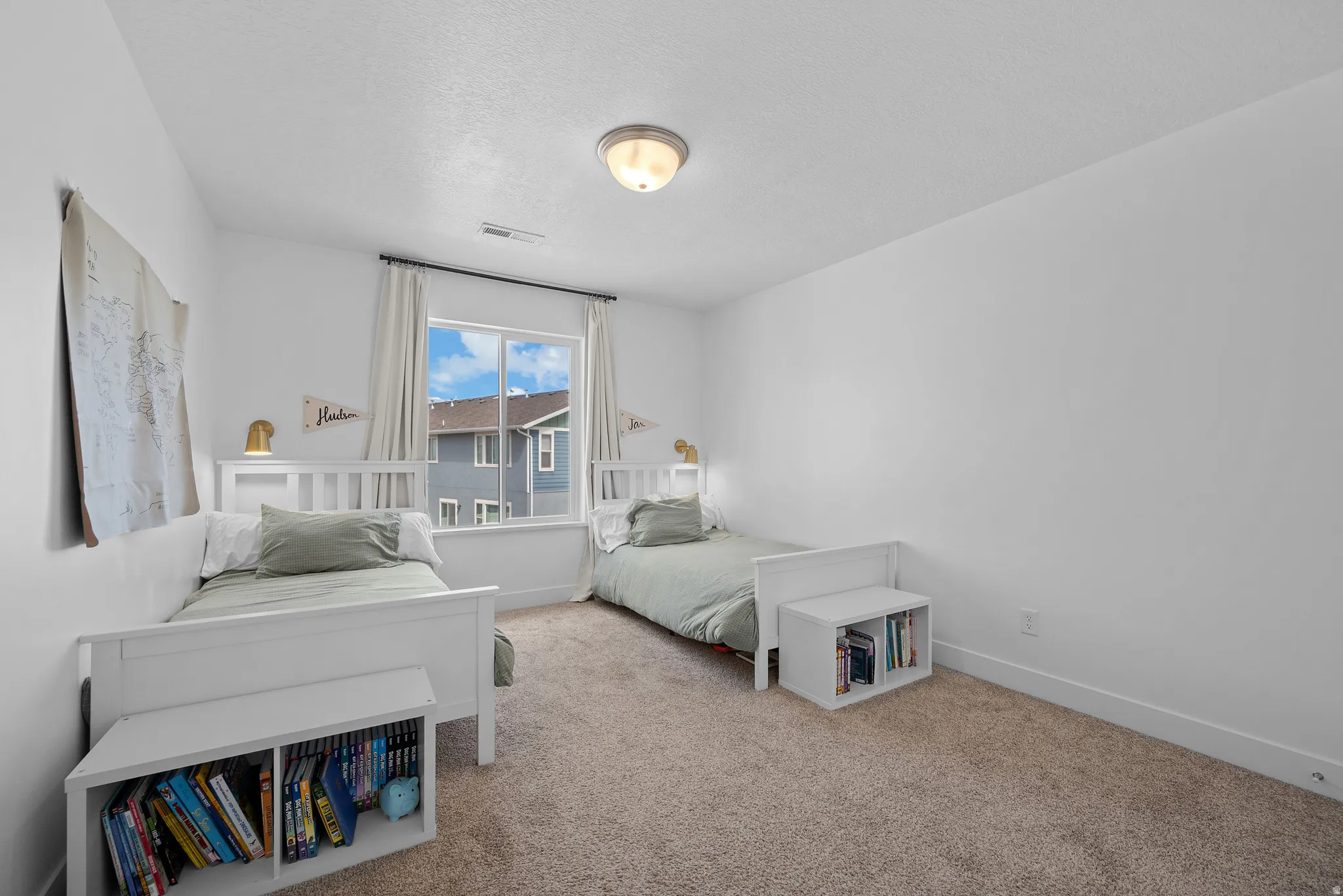 Carpeted bedroom featuring baseboards