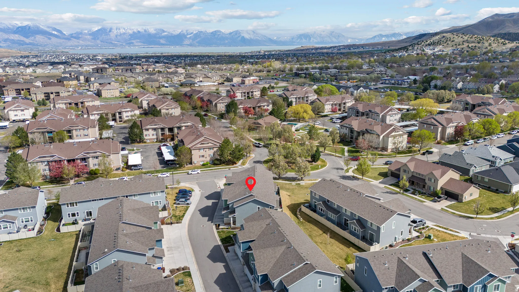 Aerial overview of property's location featuring mountains and nearby suburban area