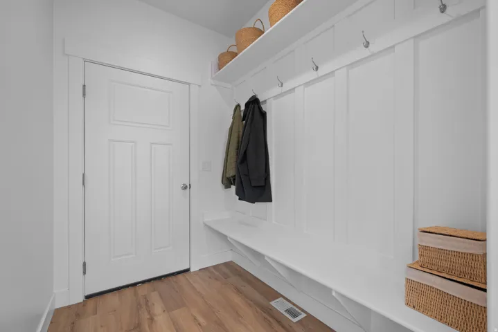 Mudroom with light wood finished floors
