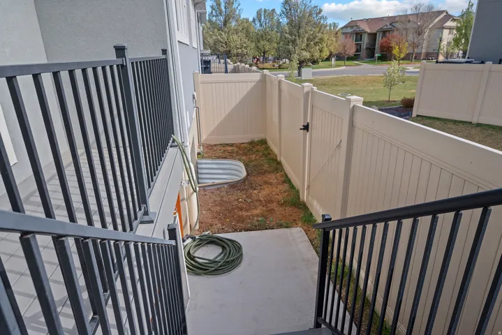 View of yard with a balcony and a patio area