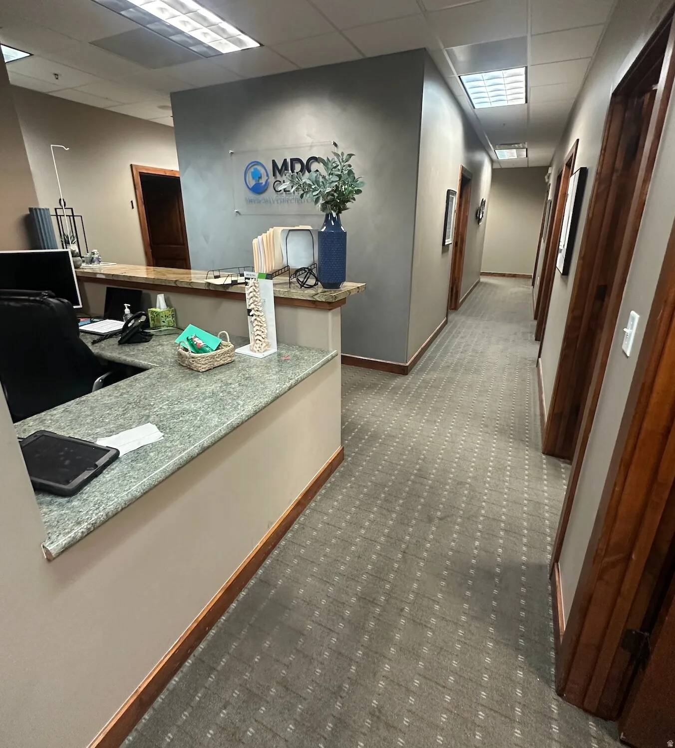Welcome area featuring a drop ceiling