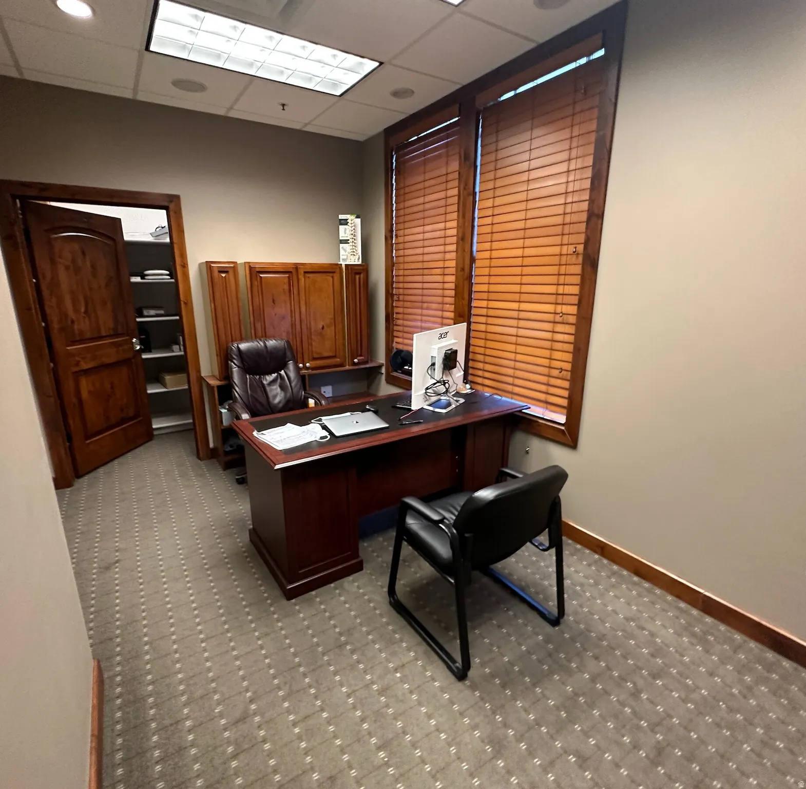 Office featuring a paneled ceiling