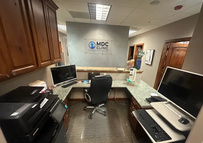 Office area featuring built in desk and a paneled ceiling