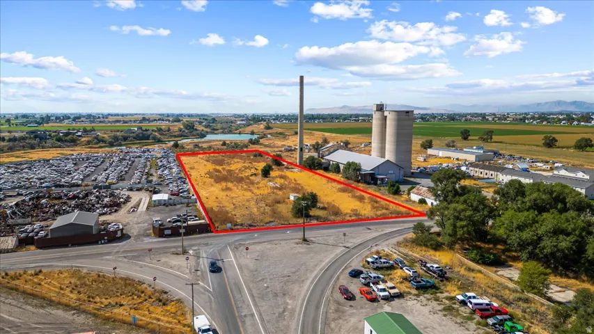Aerial overview of property's location with property parcel outlined and a mountainous background