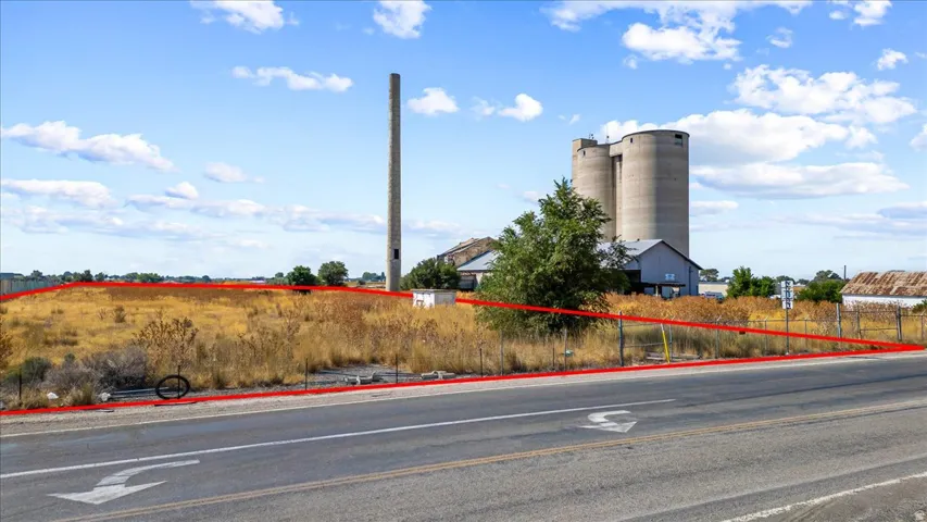 View of asphalt road with curbs