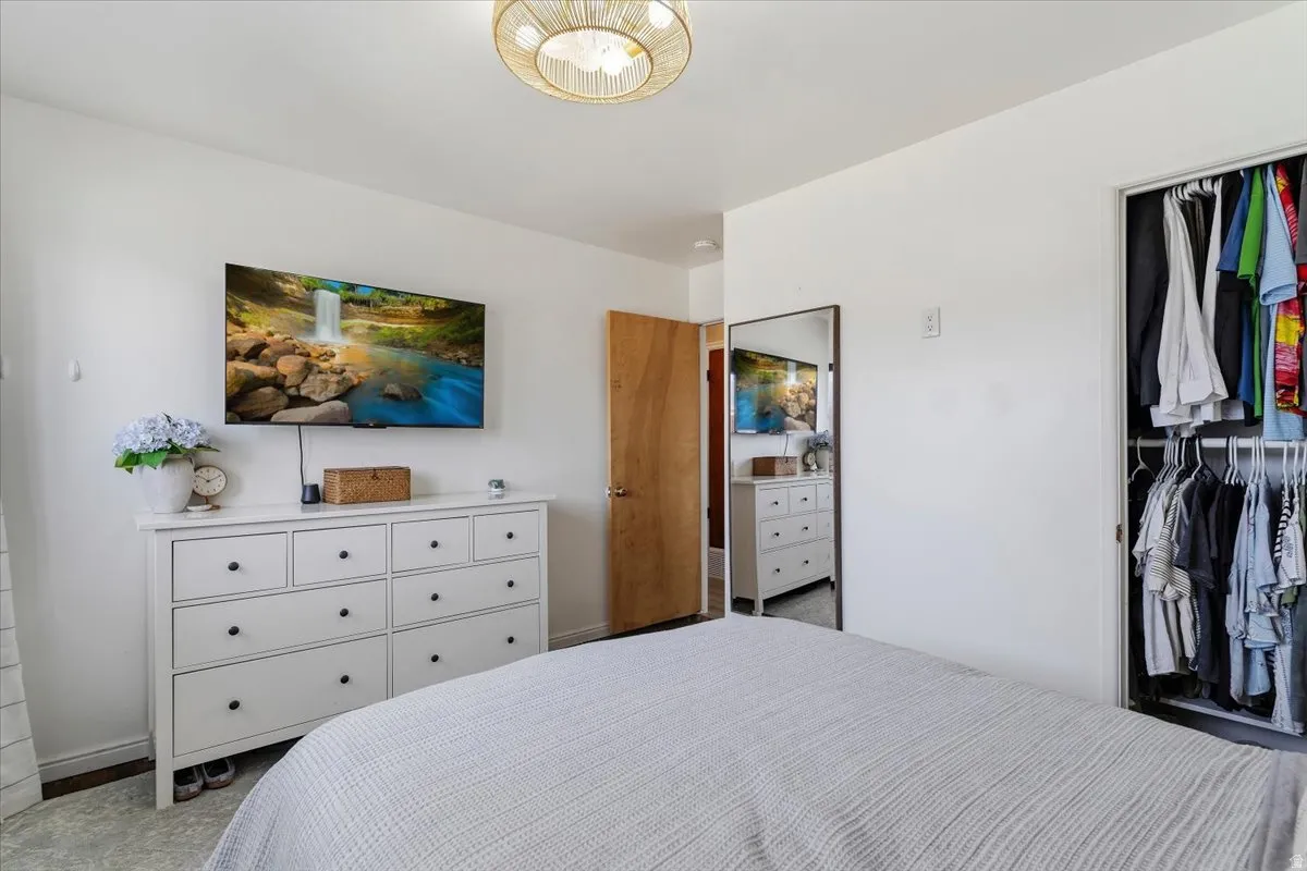 Bedroom with a closet and carpet