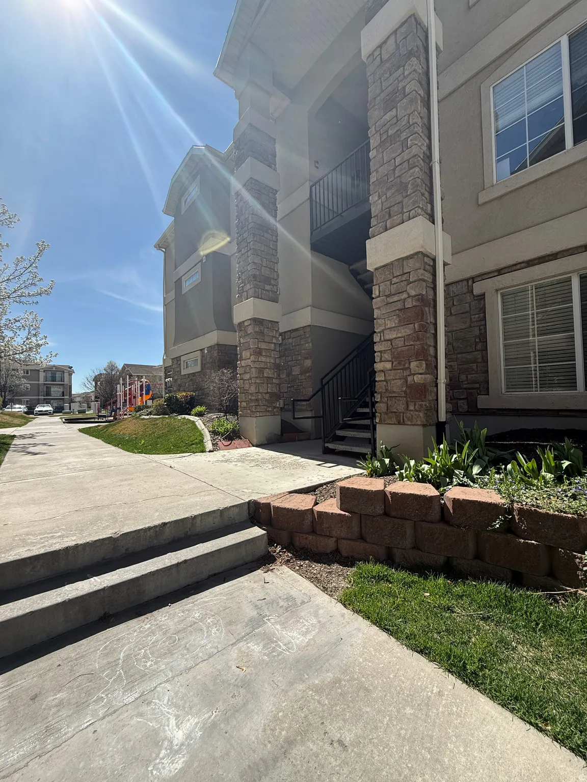 View of property's community featuring a balcony and stairway